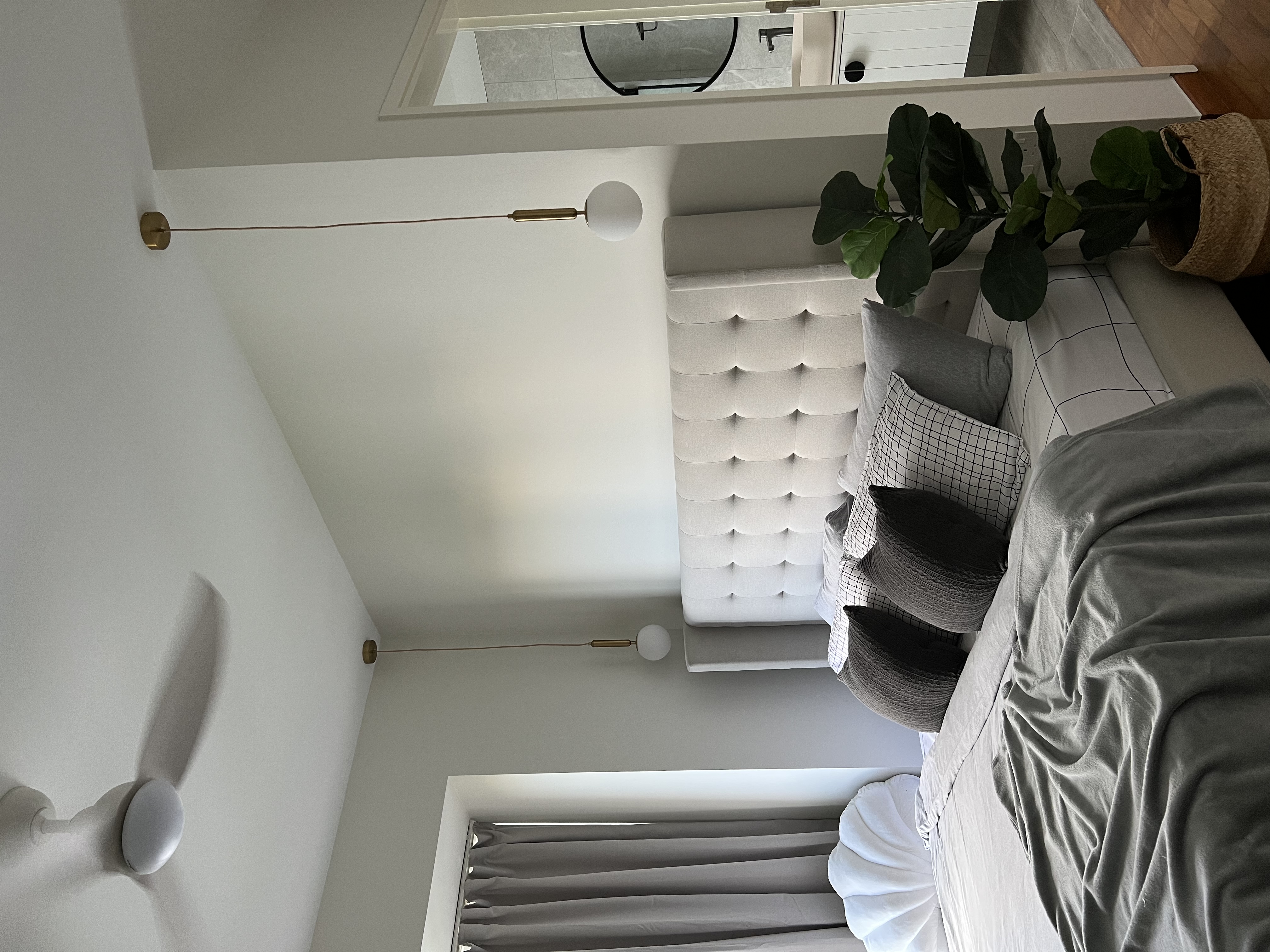 Sleek Comfort For A Good Night Rest - modern bedroom, minimalist design, cozy atmosphere, white tufted headboard, gray