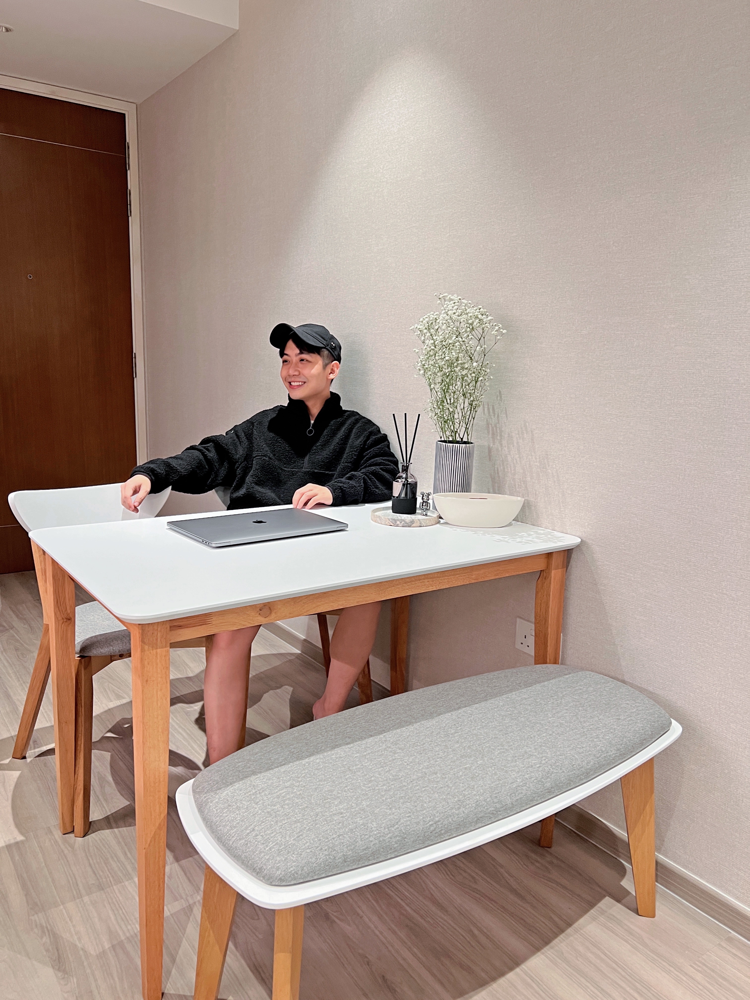 Chic Dining Area For Eating & Hosting  - Modern minimalist home office, cozy workspace, person working on laptop, comfortable