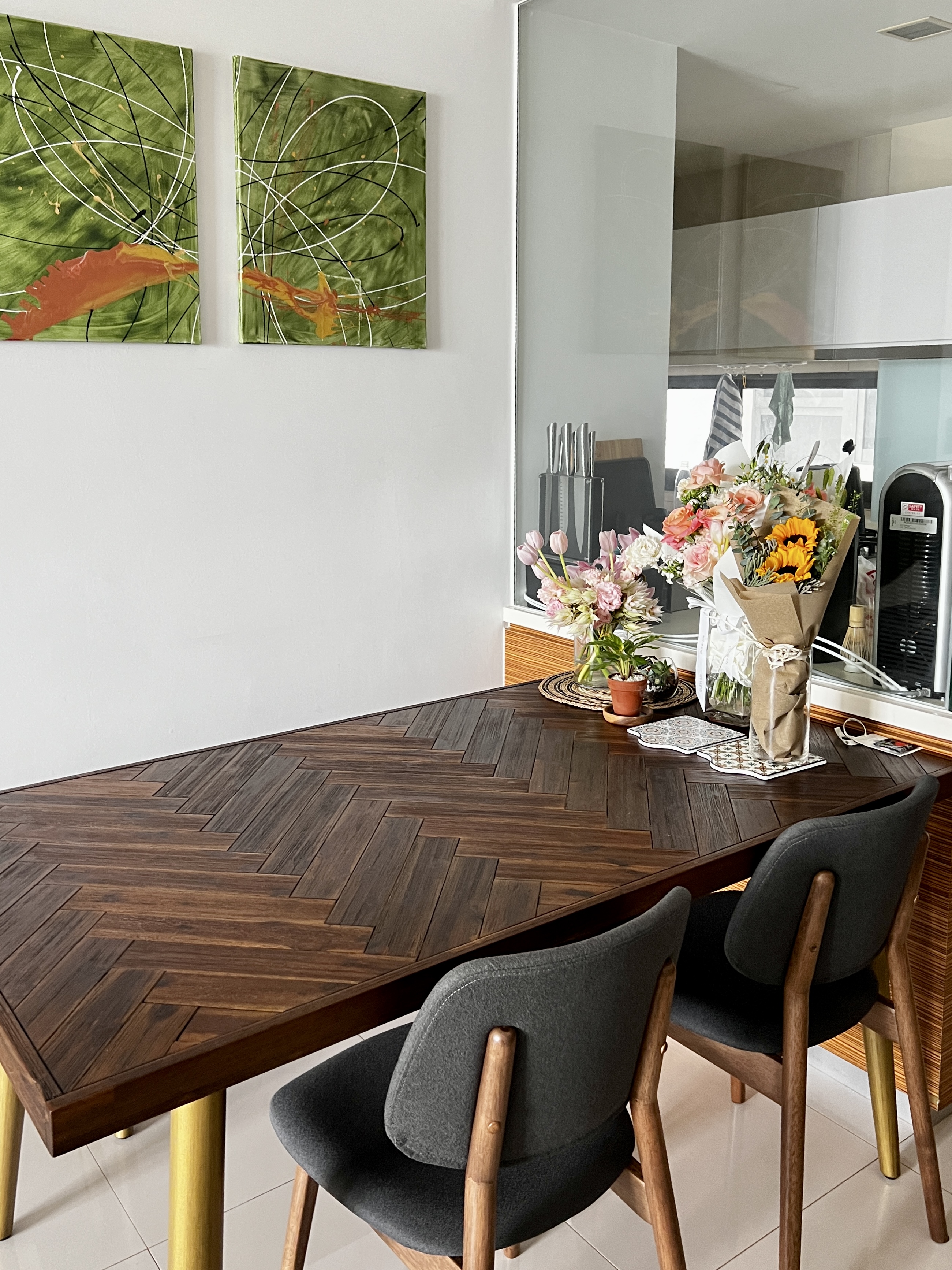 Small Yet Functional Dining Area  - Wooden dining table, modern kitchen, herringbone pattern, dark wood chairs, minimalist
