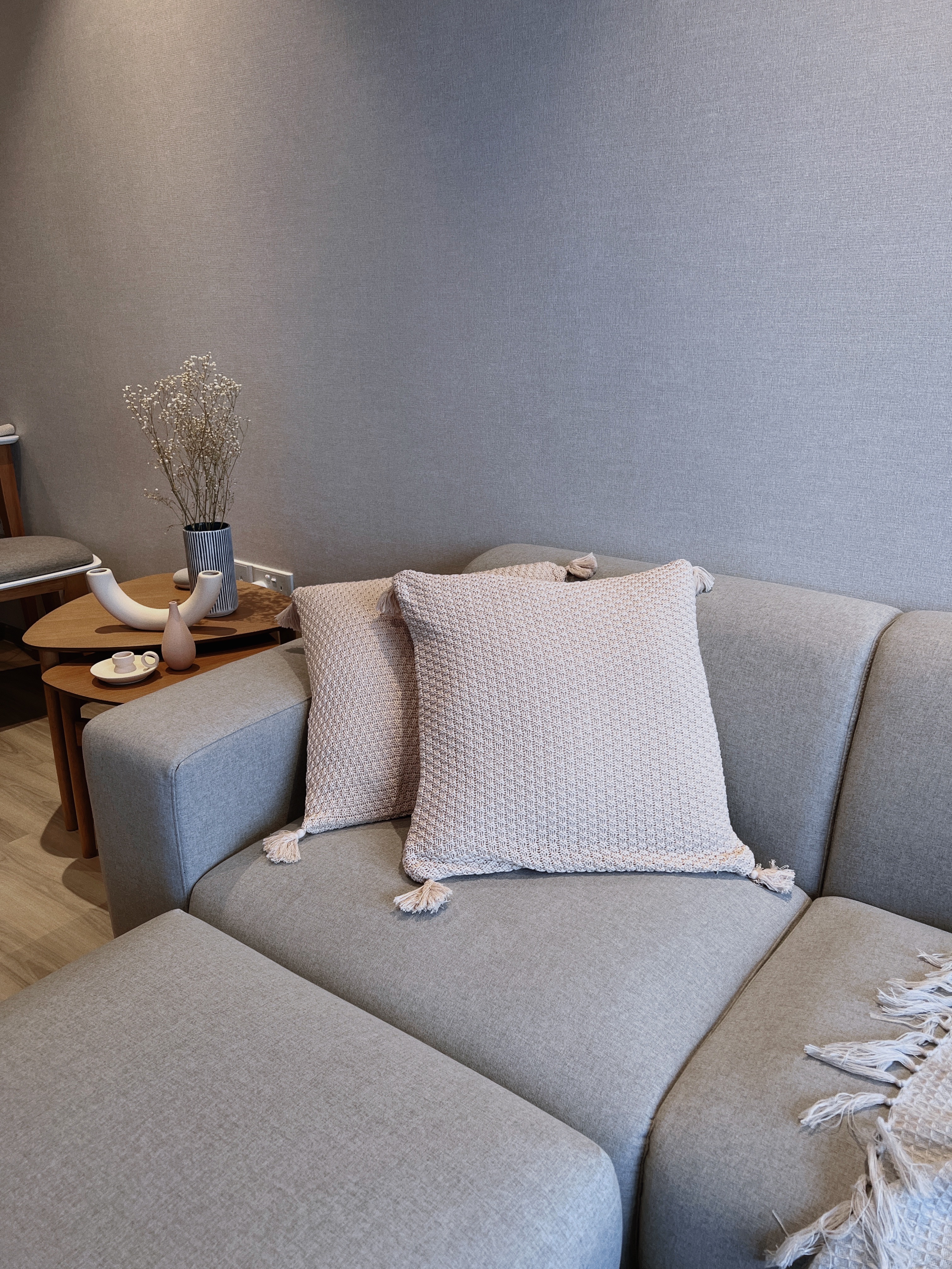 Cosy Corner To Rest & Relax After A Long Day  - Light gray sofa, textured fabric, cozy seating, modern decor, neutral tones
