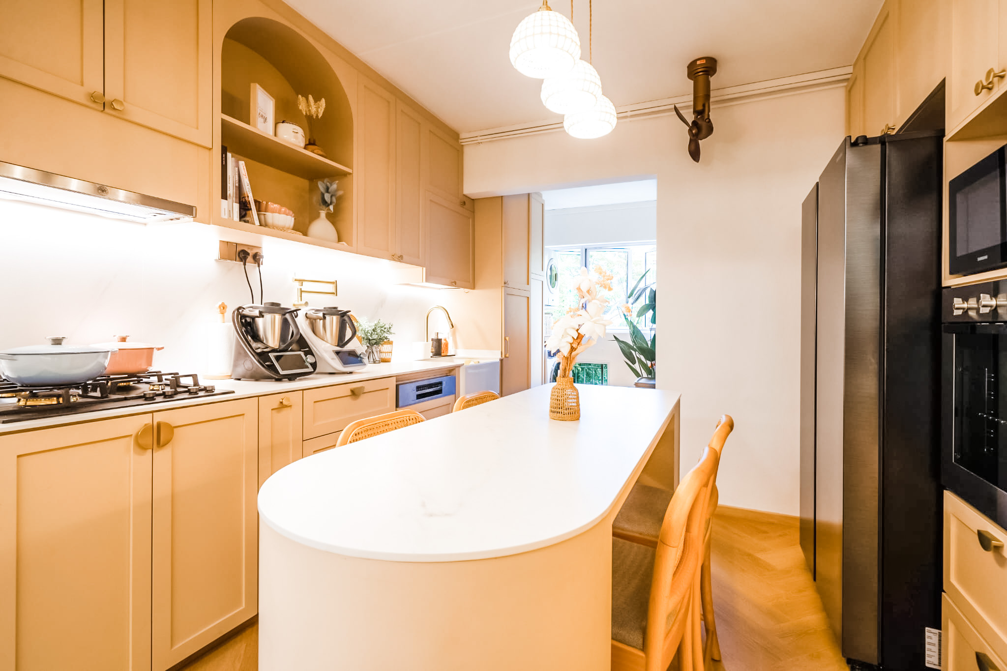 Kitchen is the soul of our home! - Cream-colored kitchen cabinets, stainless steel appliances, black refrigerator, white