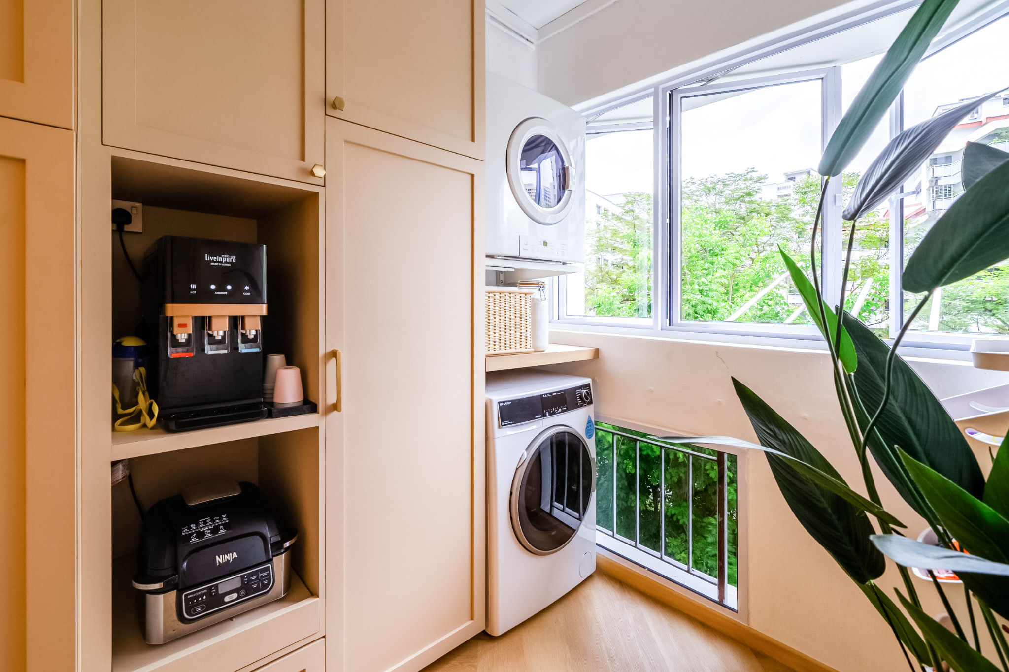 Kitchen is the soul of our home! - Kitchen cabinet, coffee machine, laundry machine, window, green plants, laundry basket