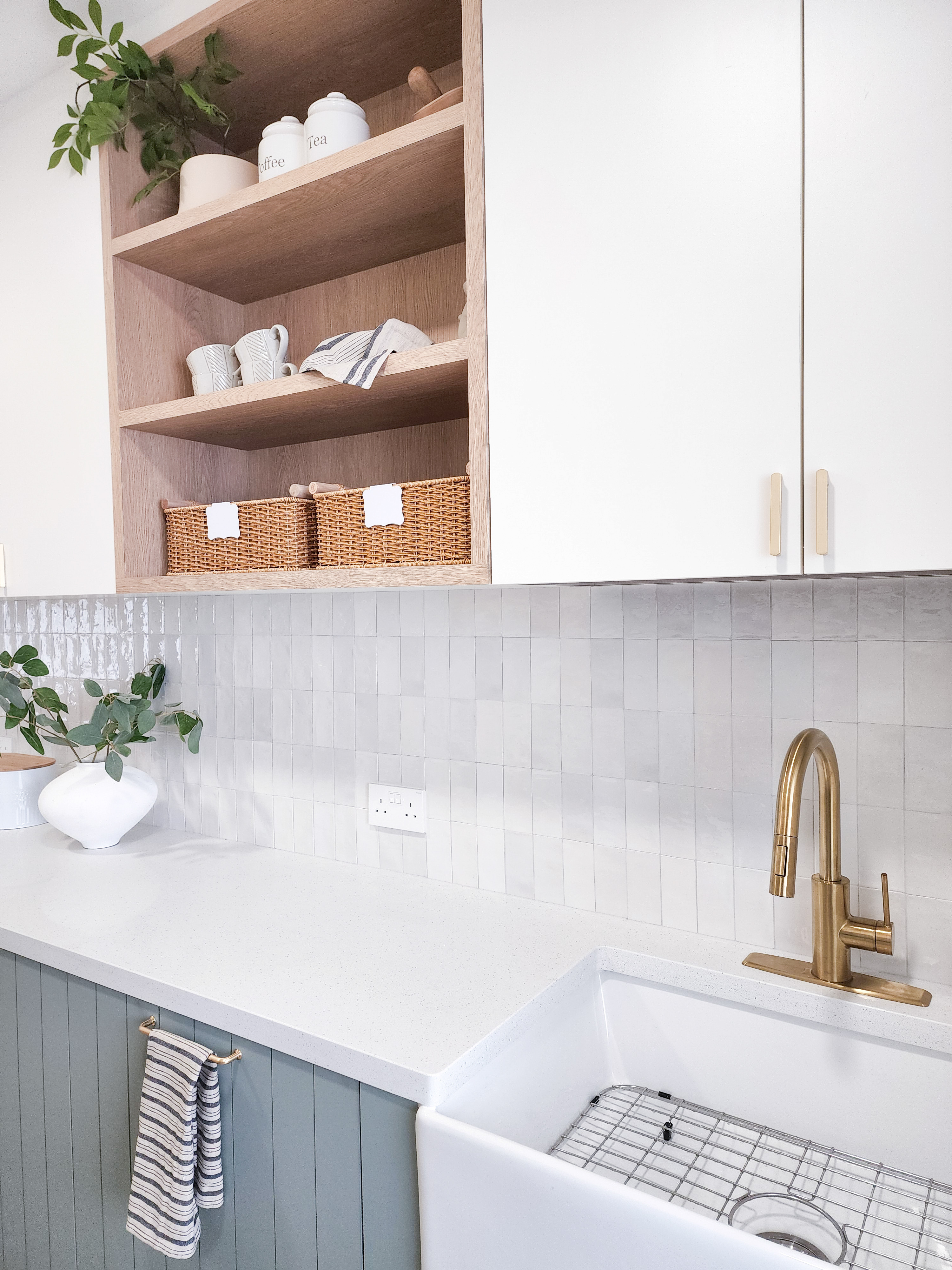 Farmhouse inspired kitchen built from scratch - Wooden shelf with white jars labeled "coffee" and "tea, " white ceramic cups