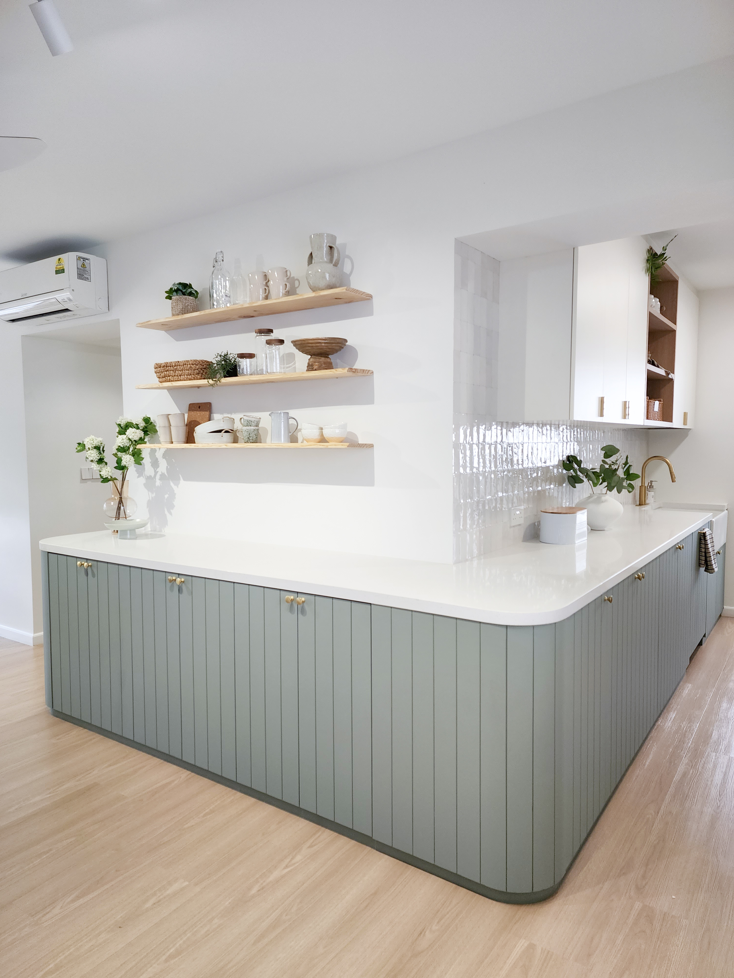 Farmhouse inspired kitchen built from scratch - modern kitchen cabinetry, light gray countertop, white island, wooden