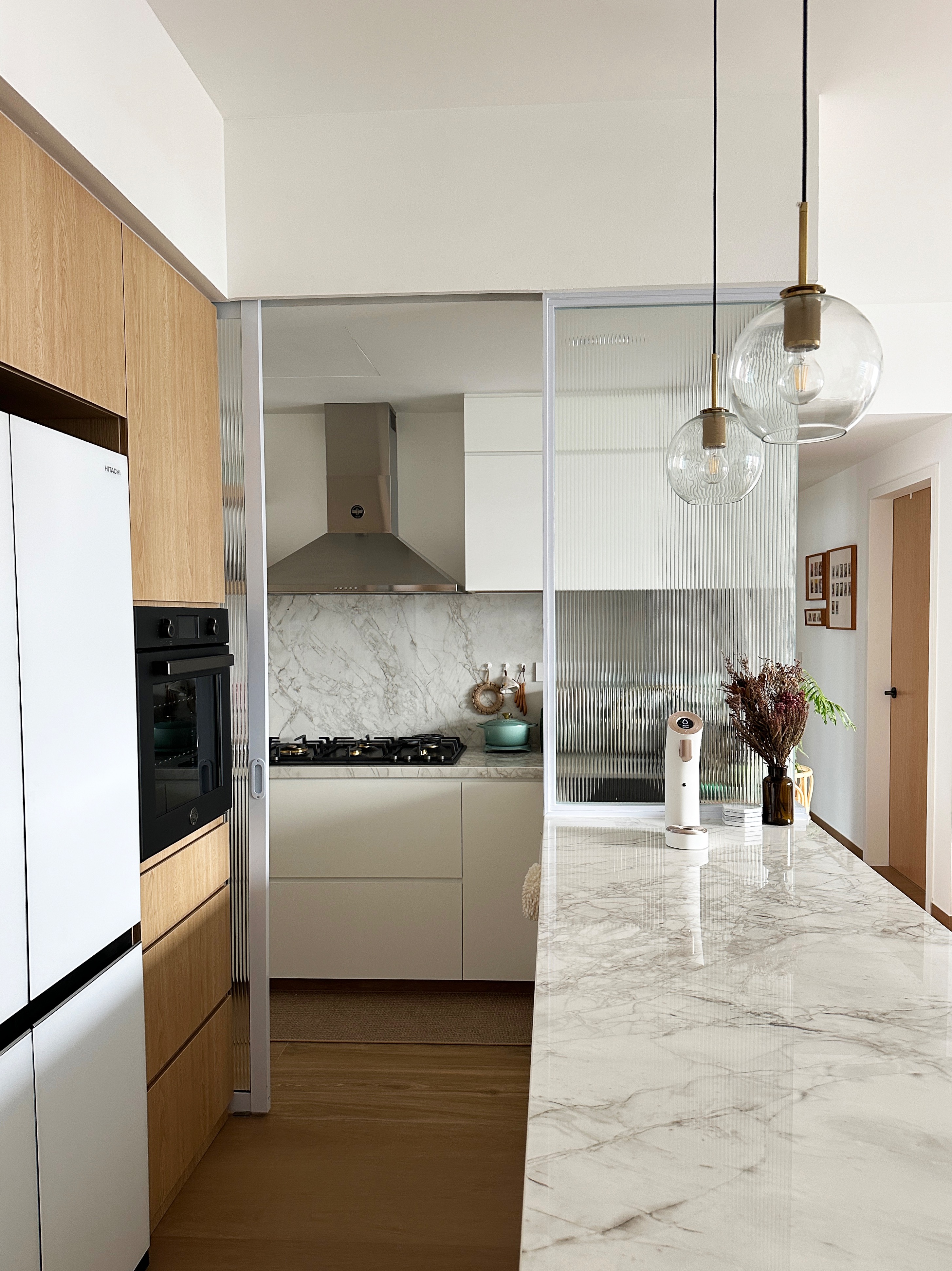 Bringing the beach vibes to our kitchen - Wooden cabinets, modern kitchen, marble countertops, sleek appliances, stainless
