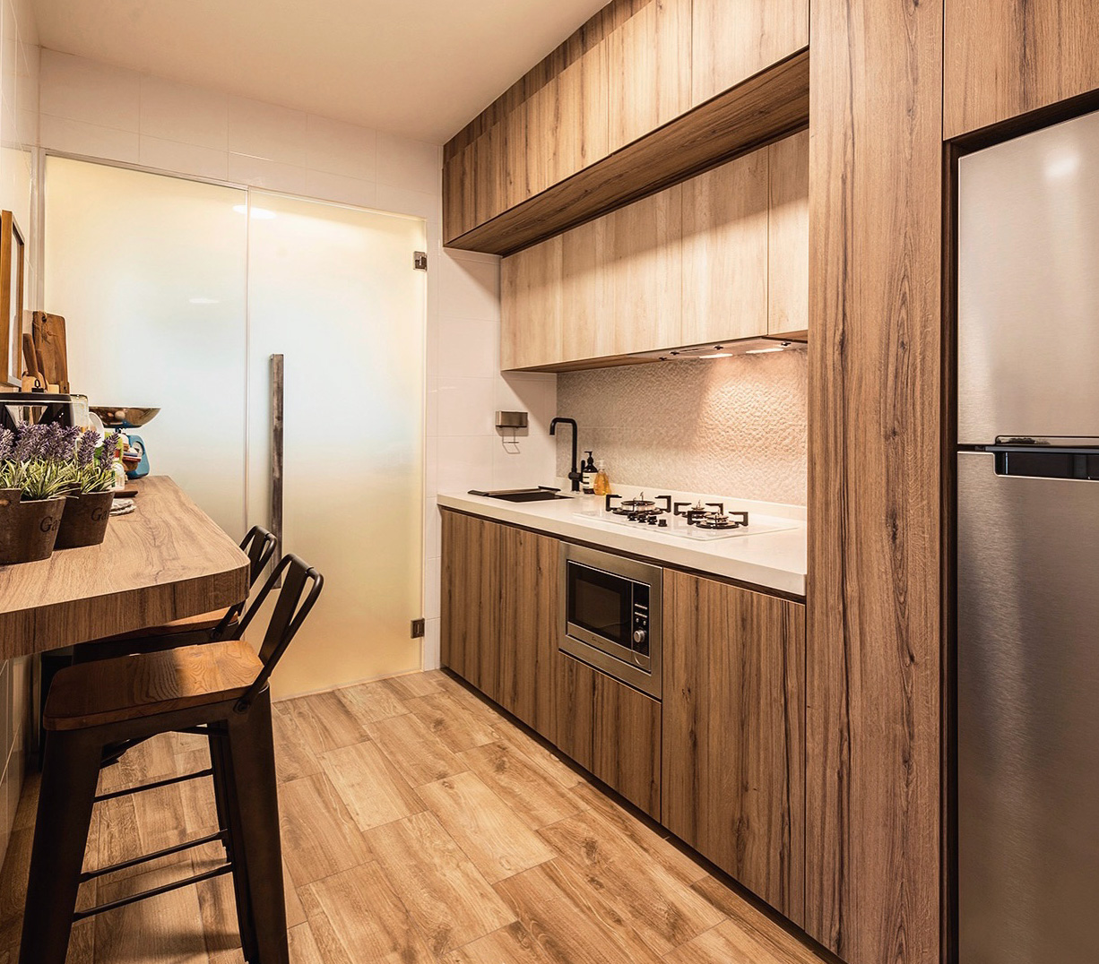 Count Your Calories In This Homey Kitchen - Wooden kitchen cabinetry, modern appliances, stainless steel refrigerator, wooden