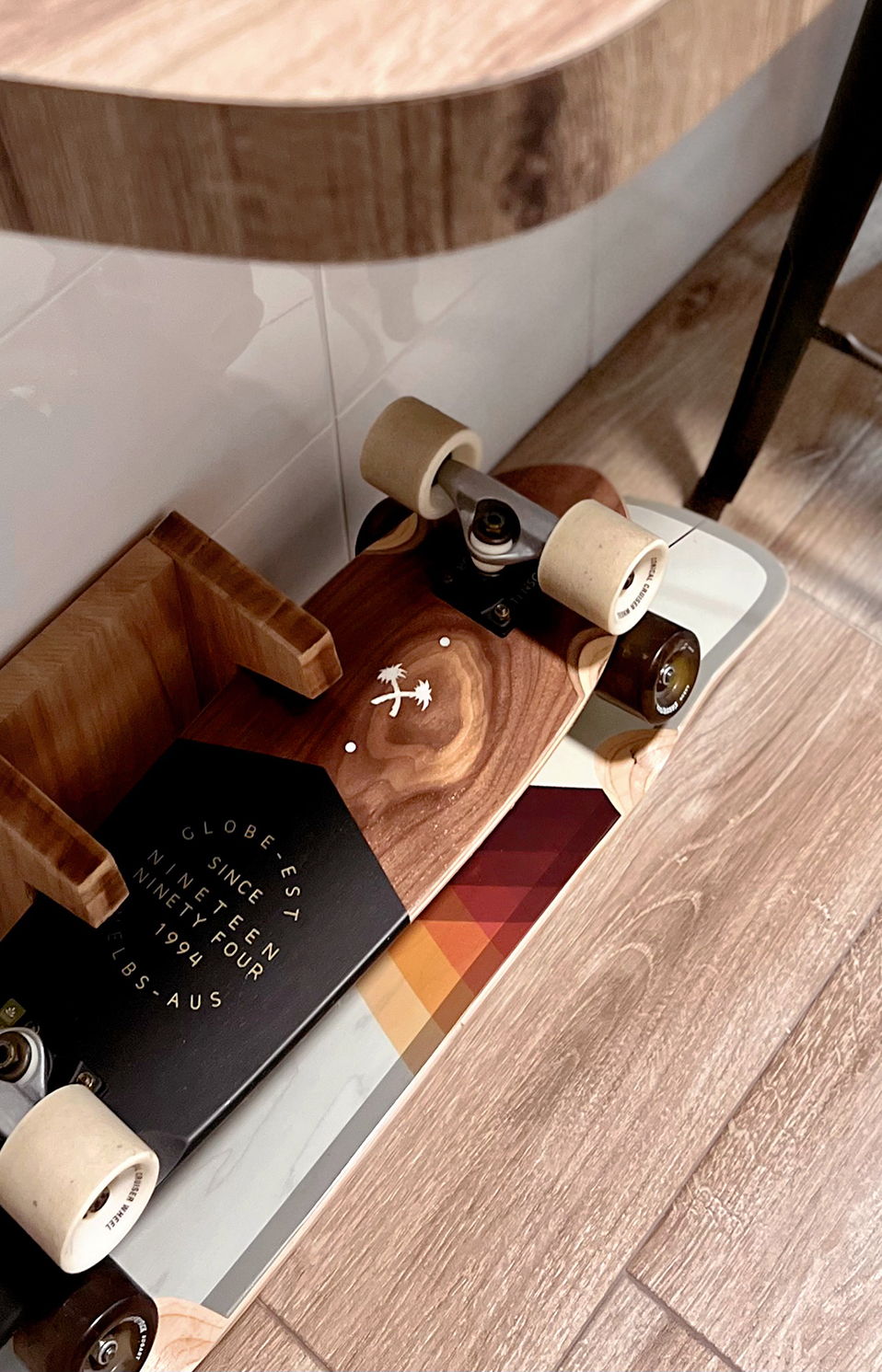 Count Your Calories In This Homey Kitchen - Wooden skateboard with black grip tape, wooden deck with white wheels, skateboard