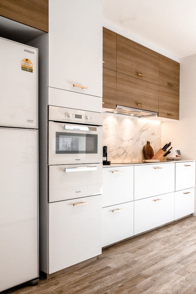 Creating a private dining kitchen space at home - White modern kitchen with integrated appliances, stainless steel
