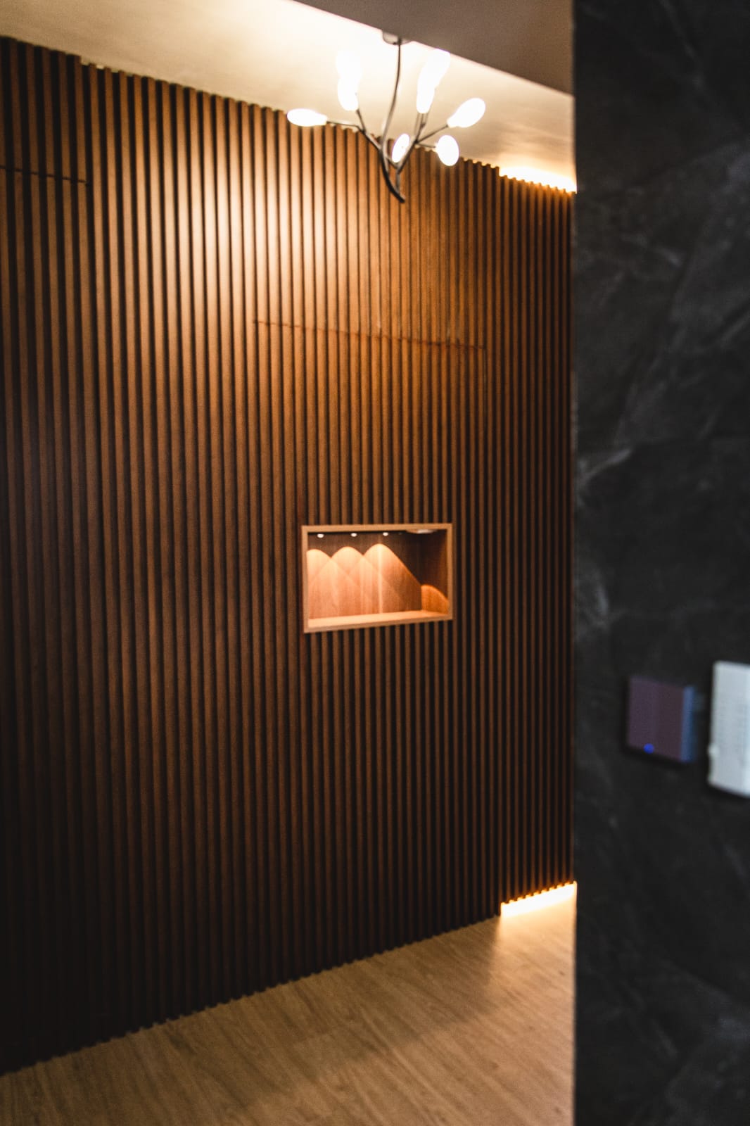 A work in progress: living alone - Wooden panel wall, modern interior design, vertical slats, warm lighting, recessed