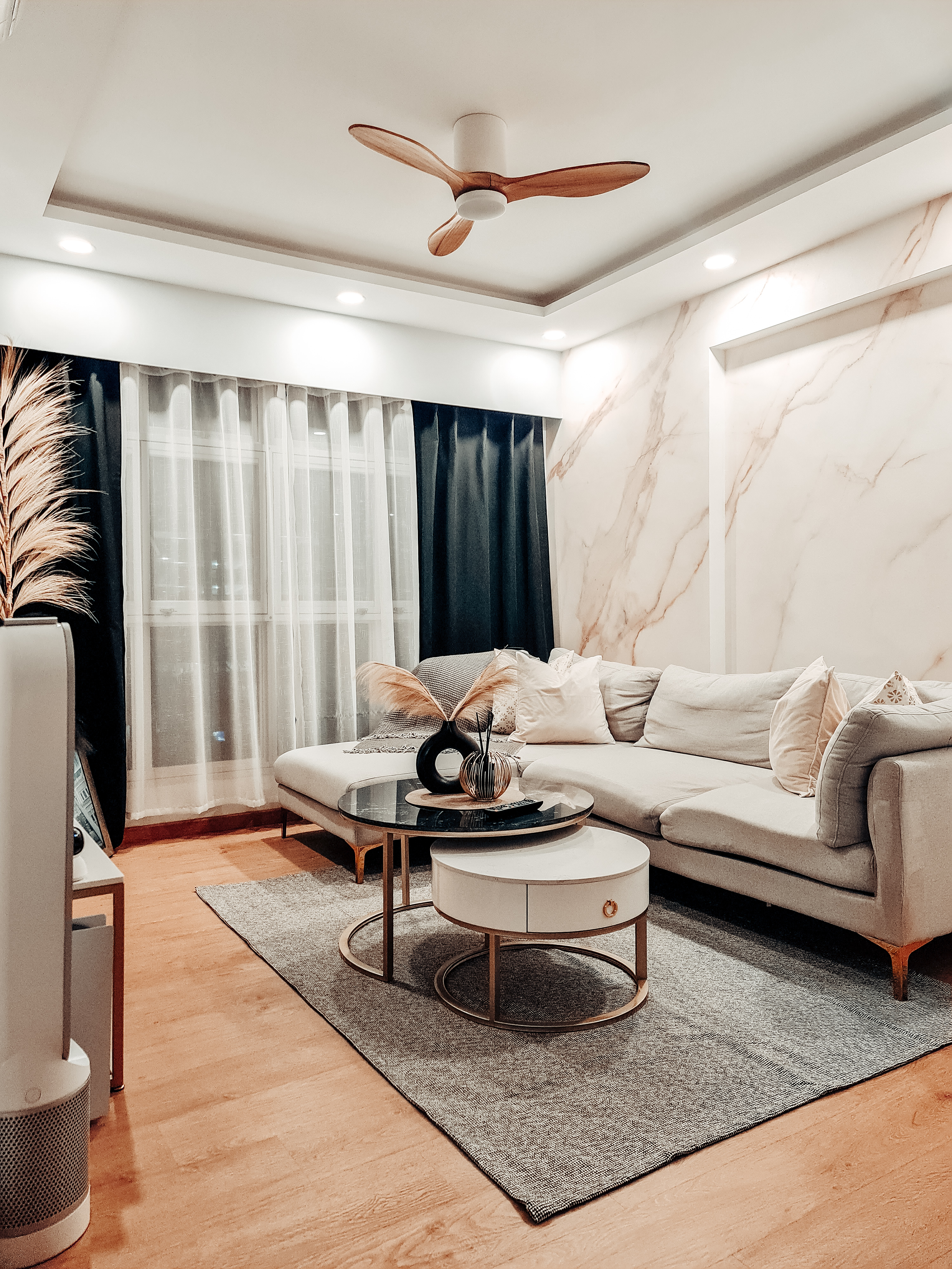 Creating a bold living room with marble wallpaper - Modern living room, cozy seating, beige sofa, decorative pillows, black