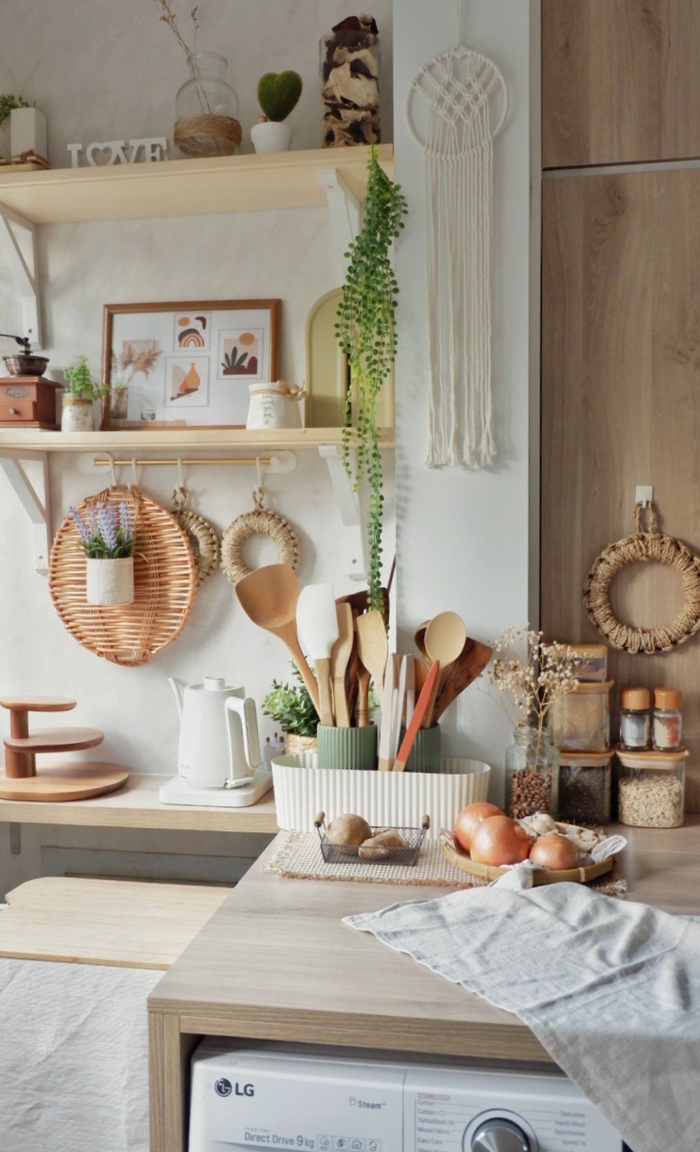 Elegant Beach Resort Inspired Kitchen - Woven baskets, rustic decor, hanging wreaths, wooden shelves, potted plants, vintage