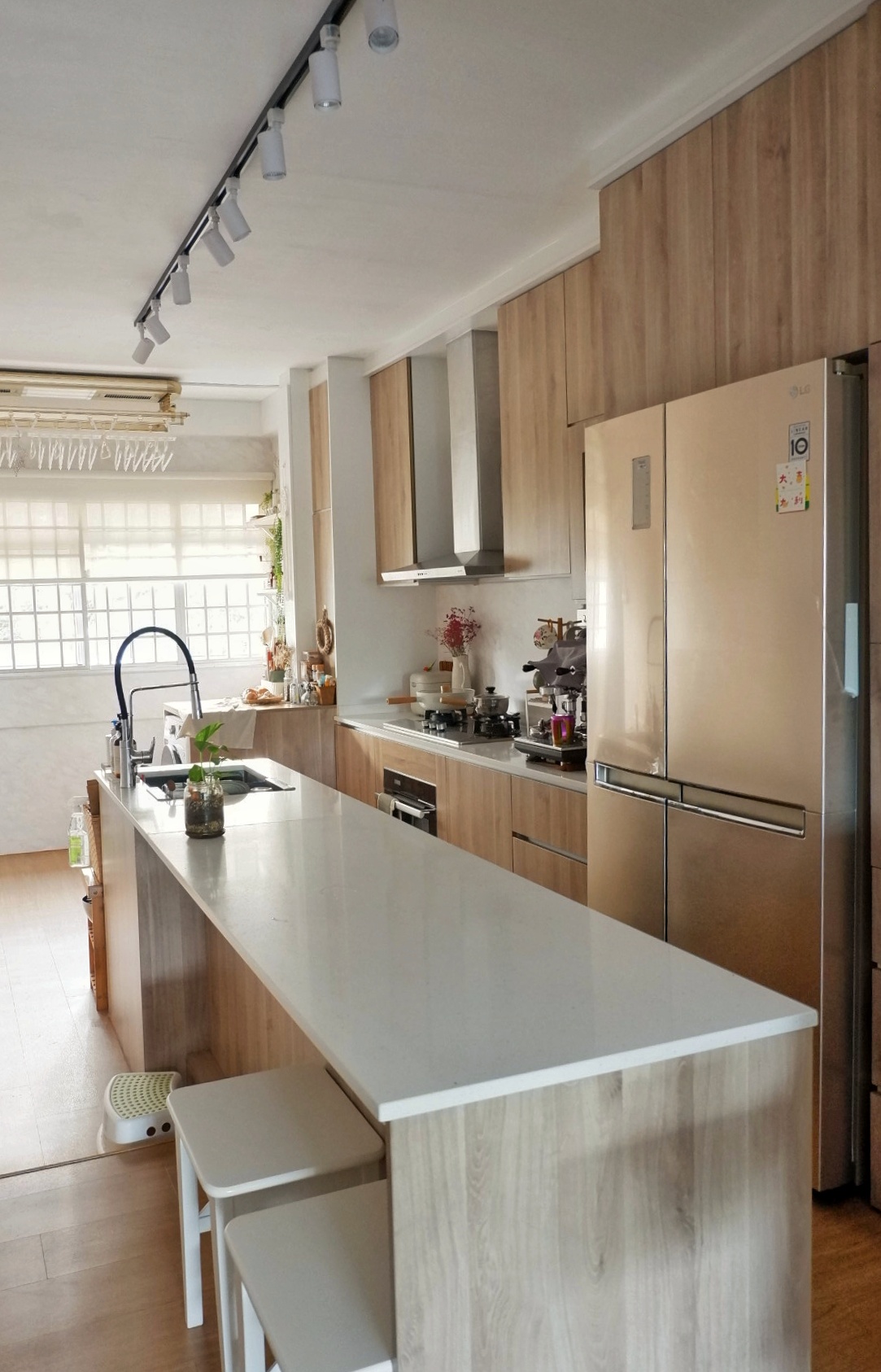 Elegant Beach Resort Inspired Kitchen - Wooden kitchen countertops, stainless steel refrigerator, modern kitchen design