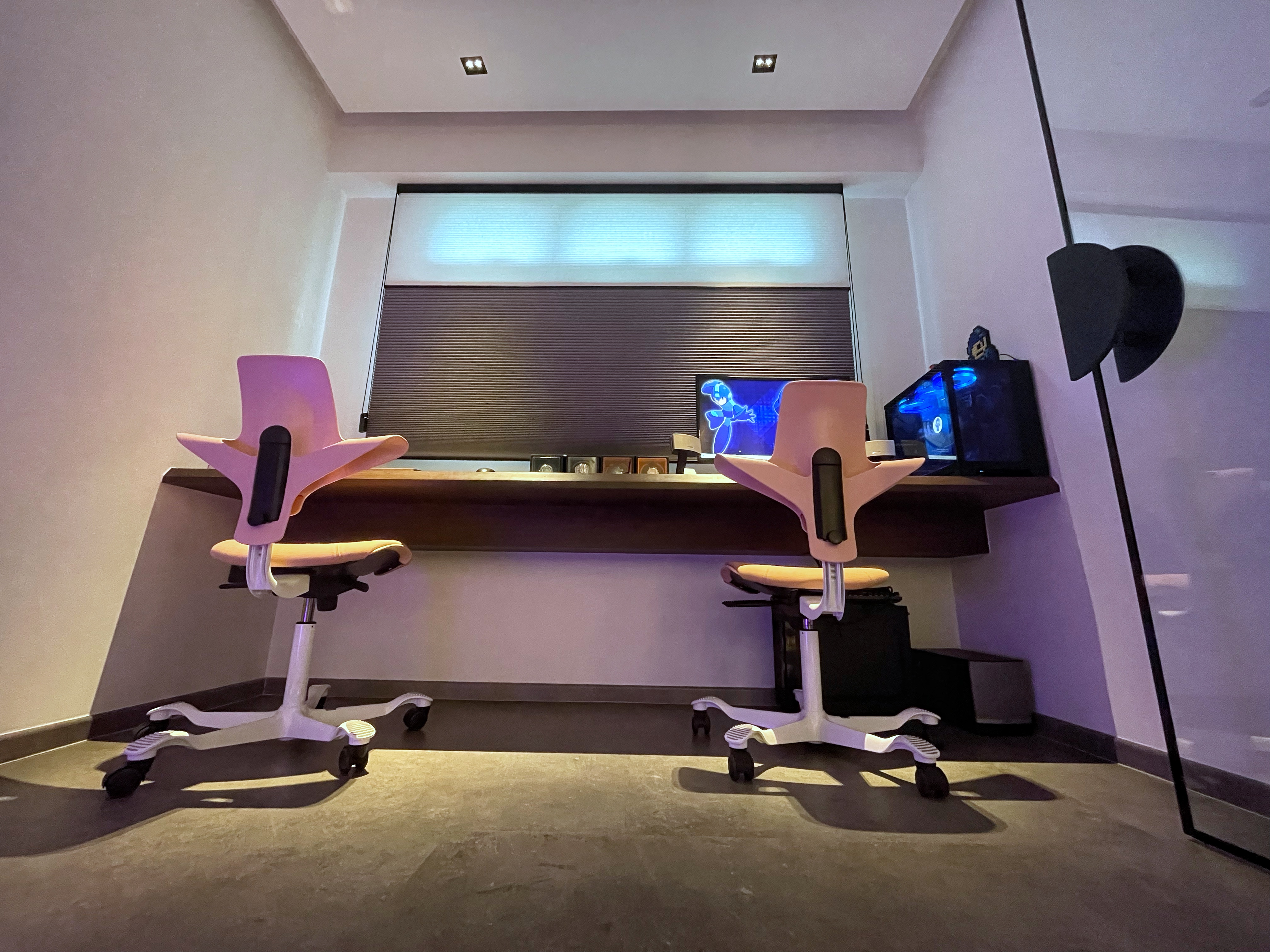 Her/his left right yours mine, a room cut in half, a study emerges. - Modern workspace, dual workstation, ergonomic chairs