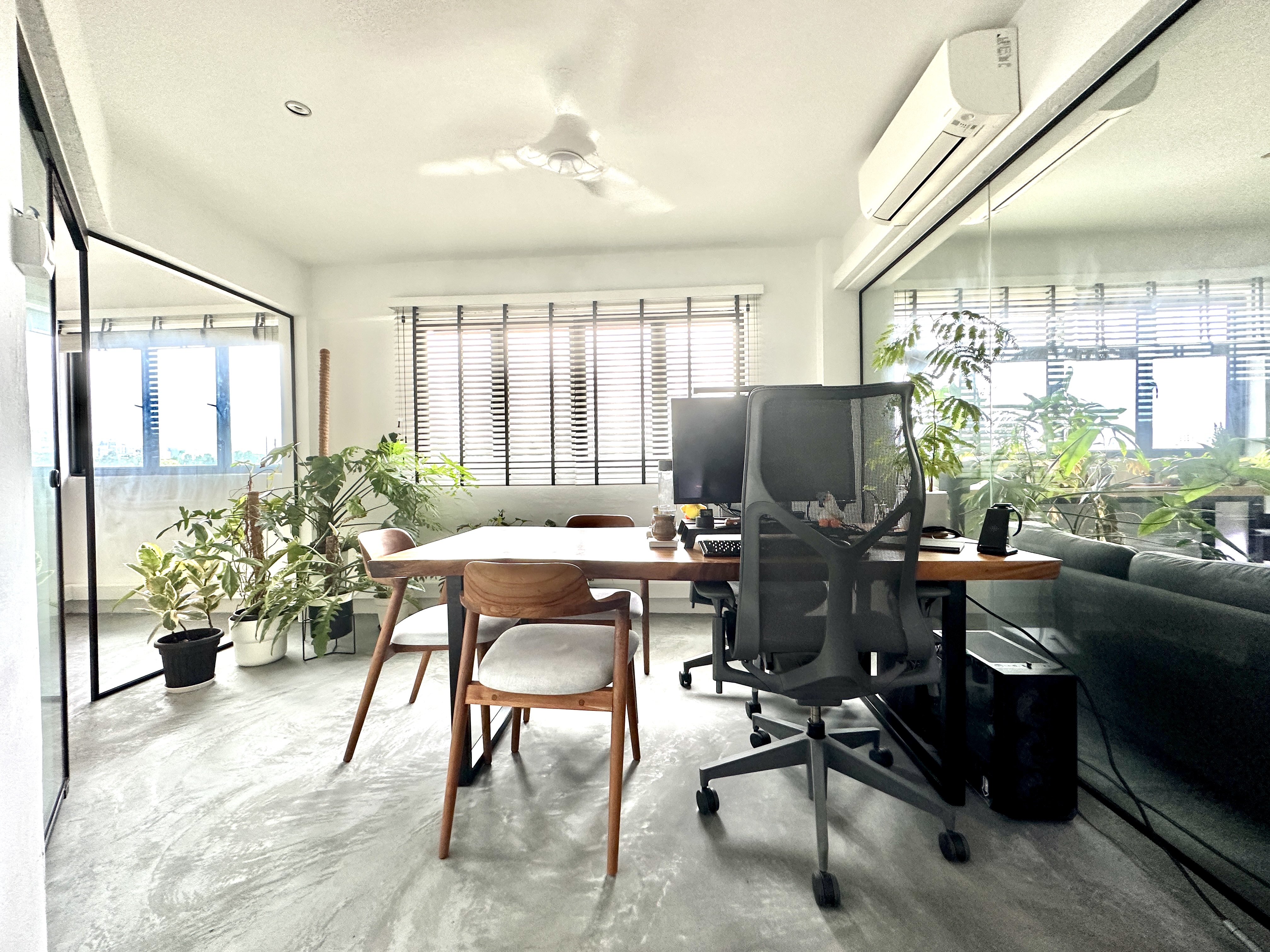 Combine dining & working space - Modern minimalist office space, sleek desk, ergonomic office chair, large window with
