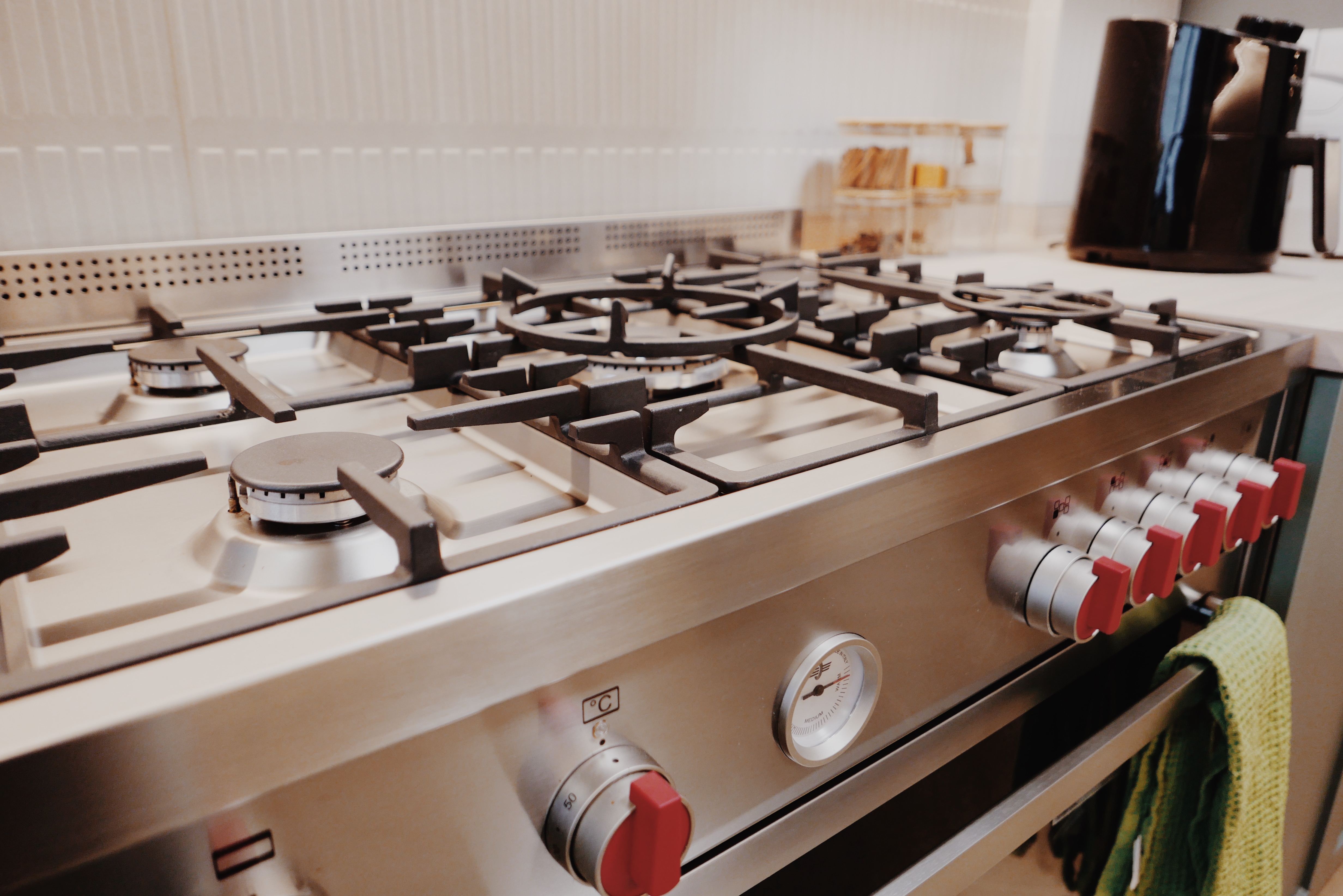 Favourite Part of Our Home! - Modern kitchen stove, gas burner, control knobs, red-hot burner, digital display, control