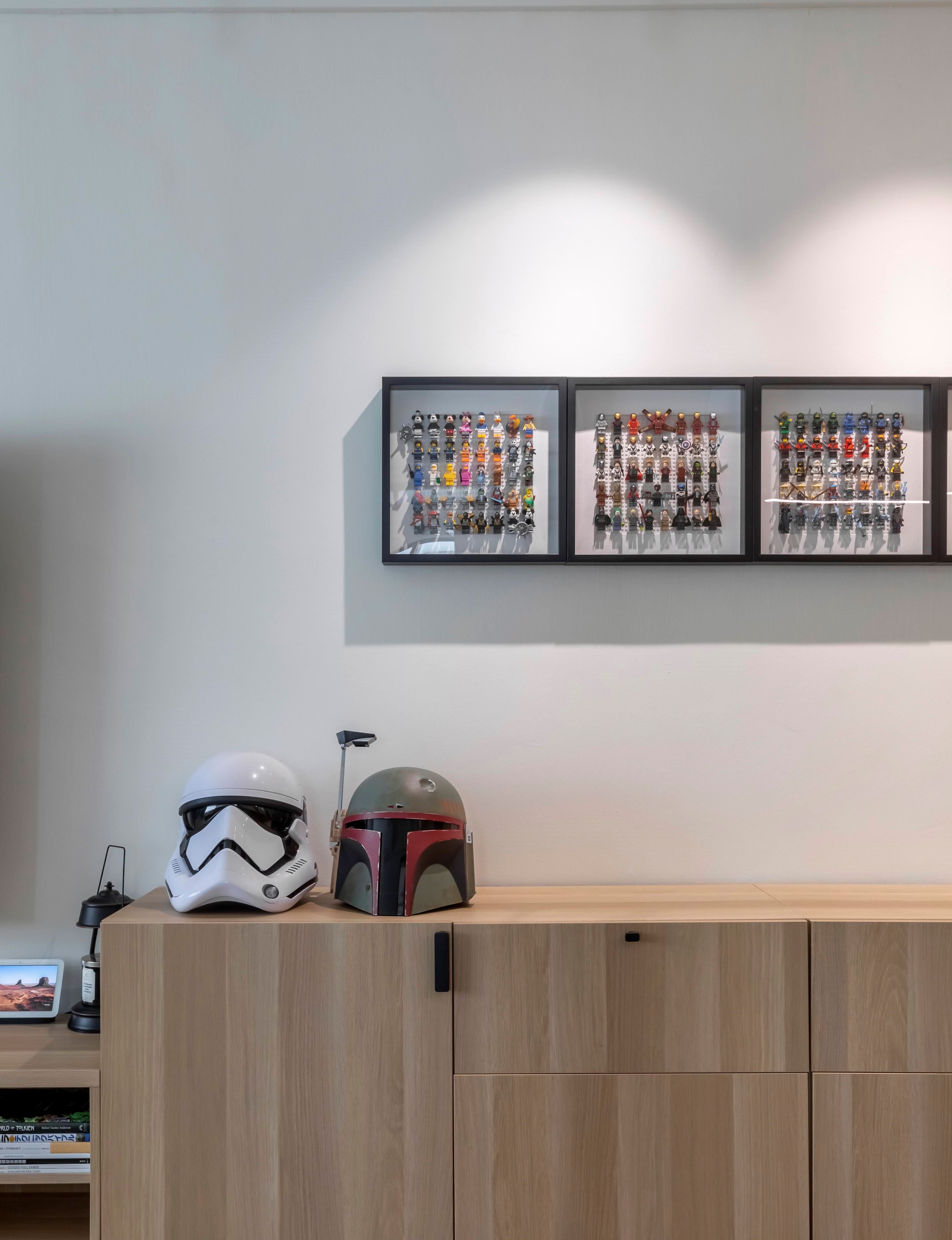 A fairly simple dining area as an extension of our living room - Wall-mounted display featuring Star Wars memorabilia