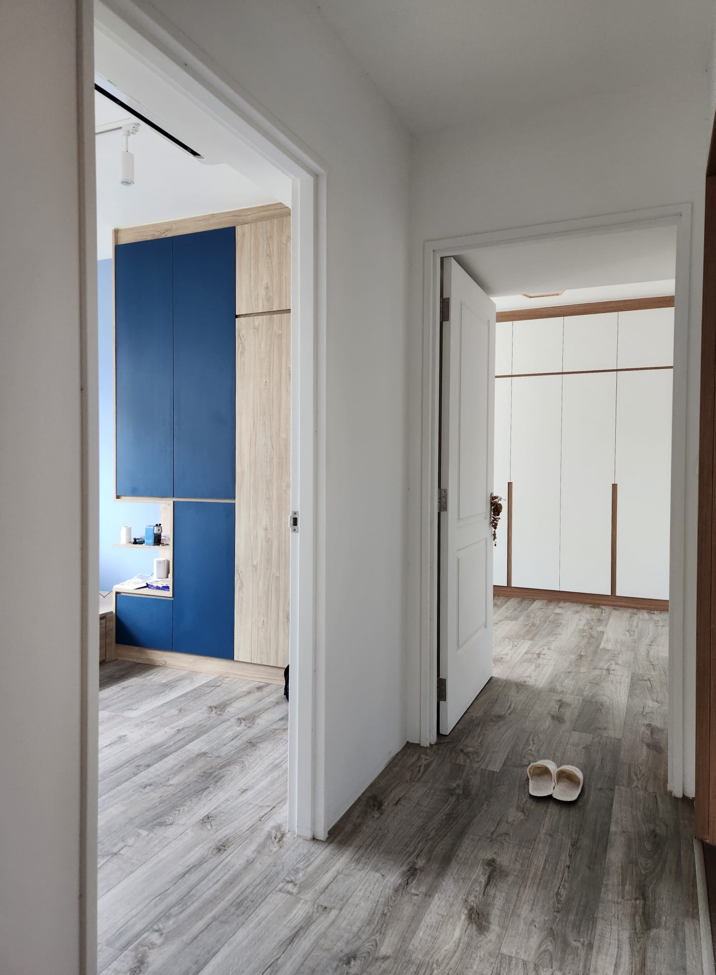 A warm and cozy bedroom to come home to - Wooden cabinetry, modern design, blue and white color scheme, minimalist style