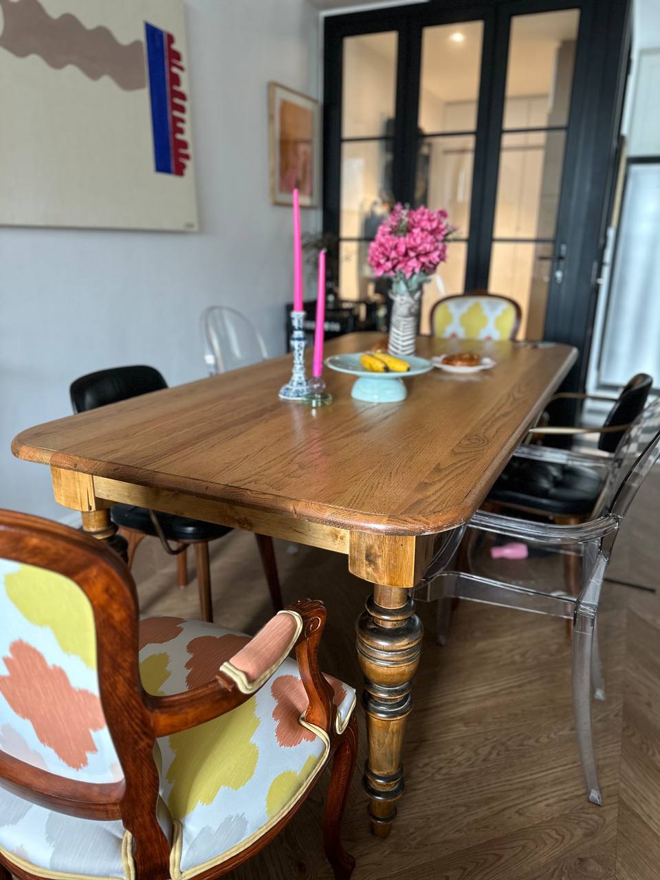 Curating our dining space with thrifted treasures - Wooden dining table, modern chairs, colorful patterned upholstery, pink