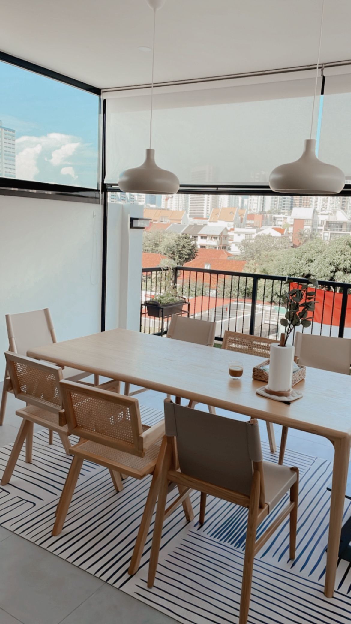 Our Minimalist Kitchen is a conversation starter - Modern dining room with minimalist design, large windows offering a city