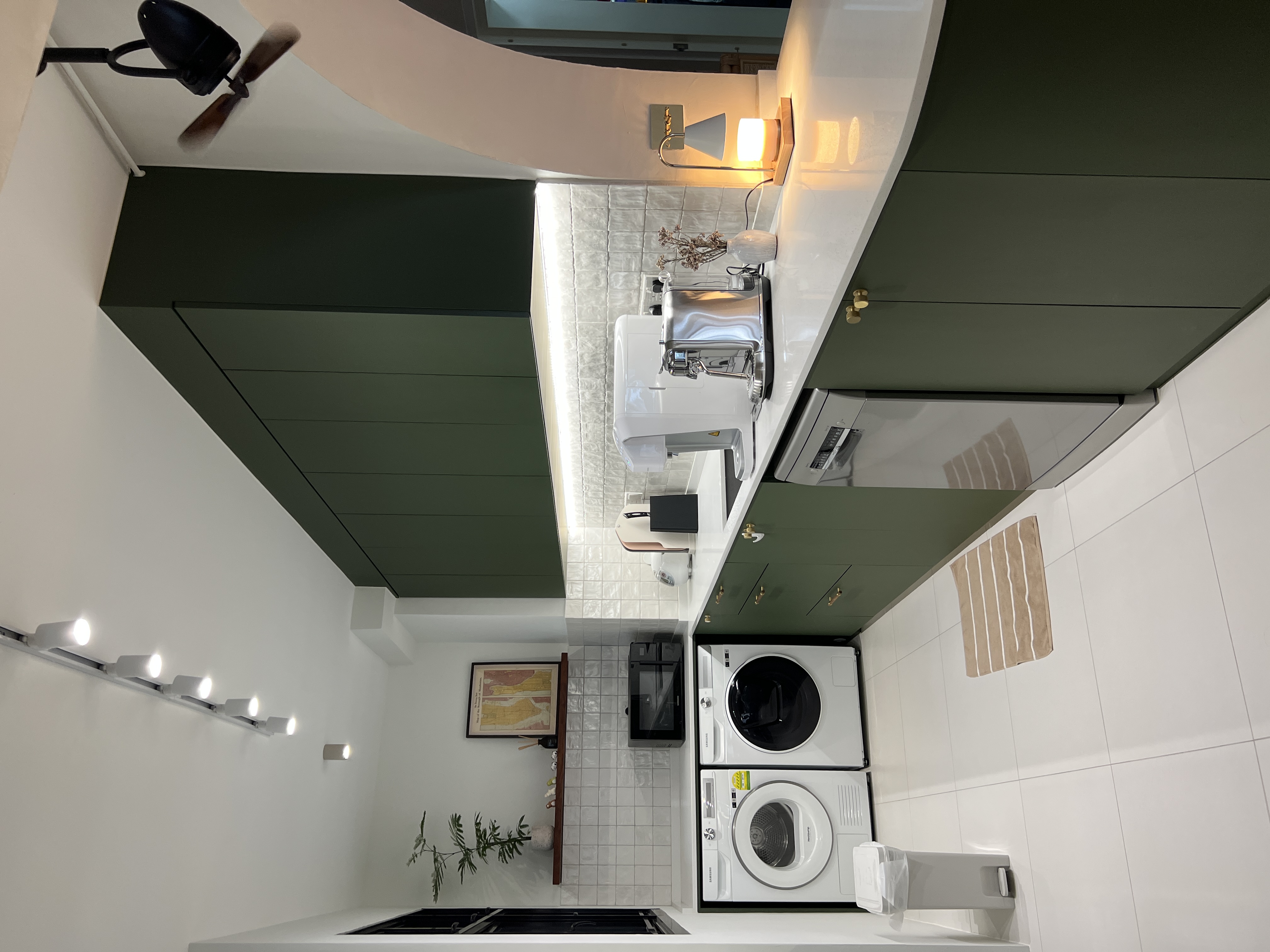 Cooking up a storm with an open-concept kitchen  - Modern kitchen with sleek design, green cabinets, white countertops