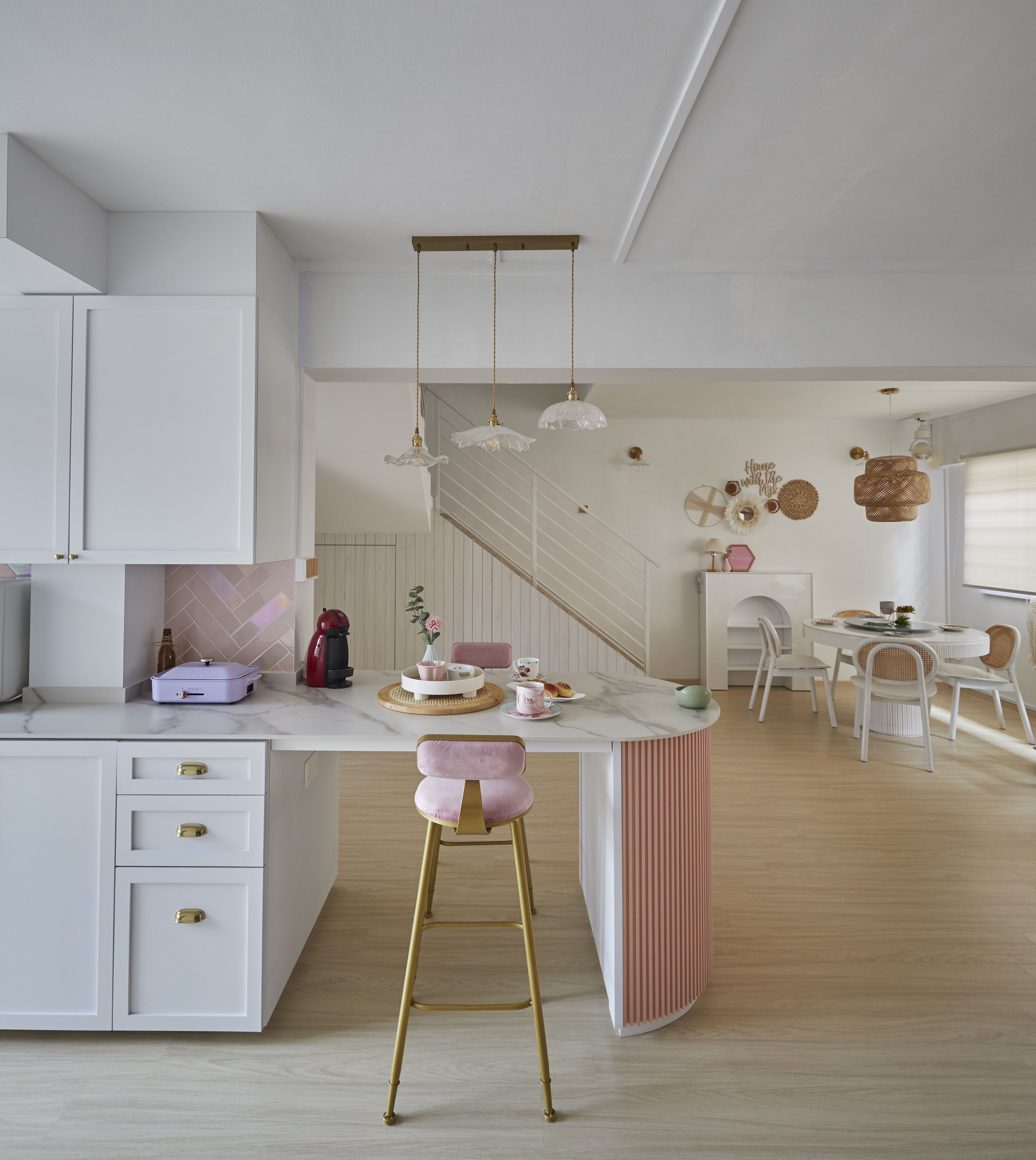 A beautiful restful sanctuary - my dream home! - White kitchen with minimalist design, modern pendant lights, pink and white