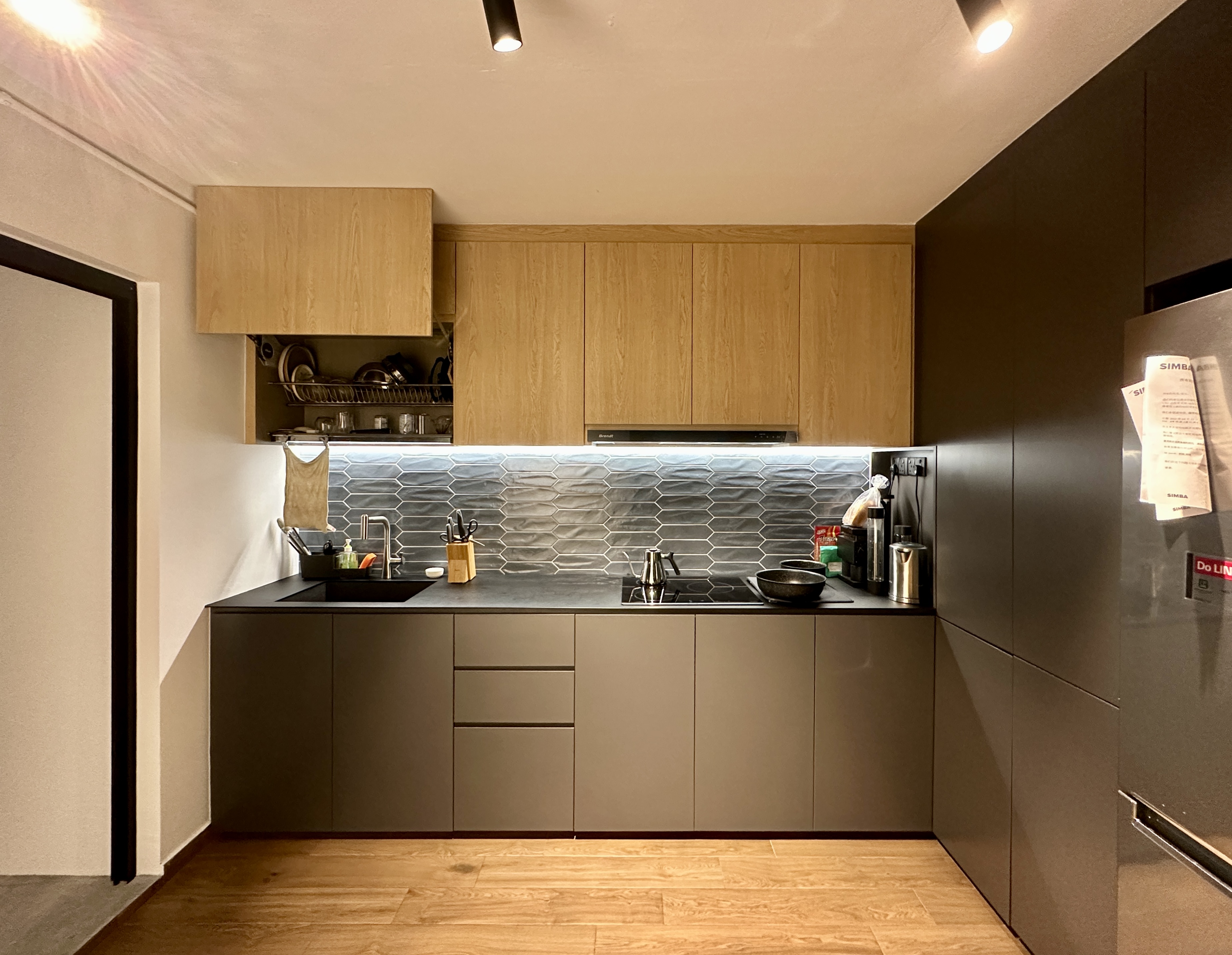 Spacious and bright Kitchen - Modern kitchen with sleek design, wooden cabinets, stainless steel appliances, black