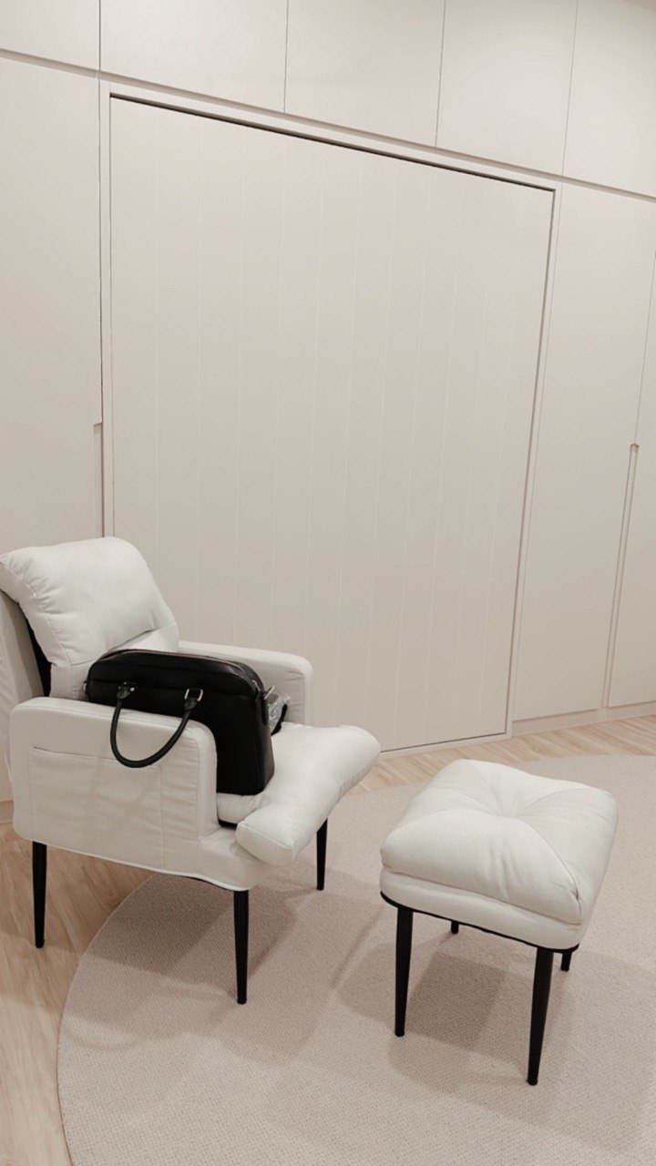 Getting the day off to a productive start in my study room  - White upholstered armchair, black leather bag, minimalist