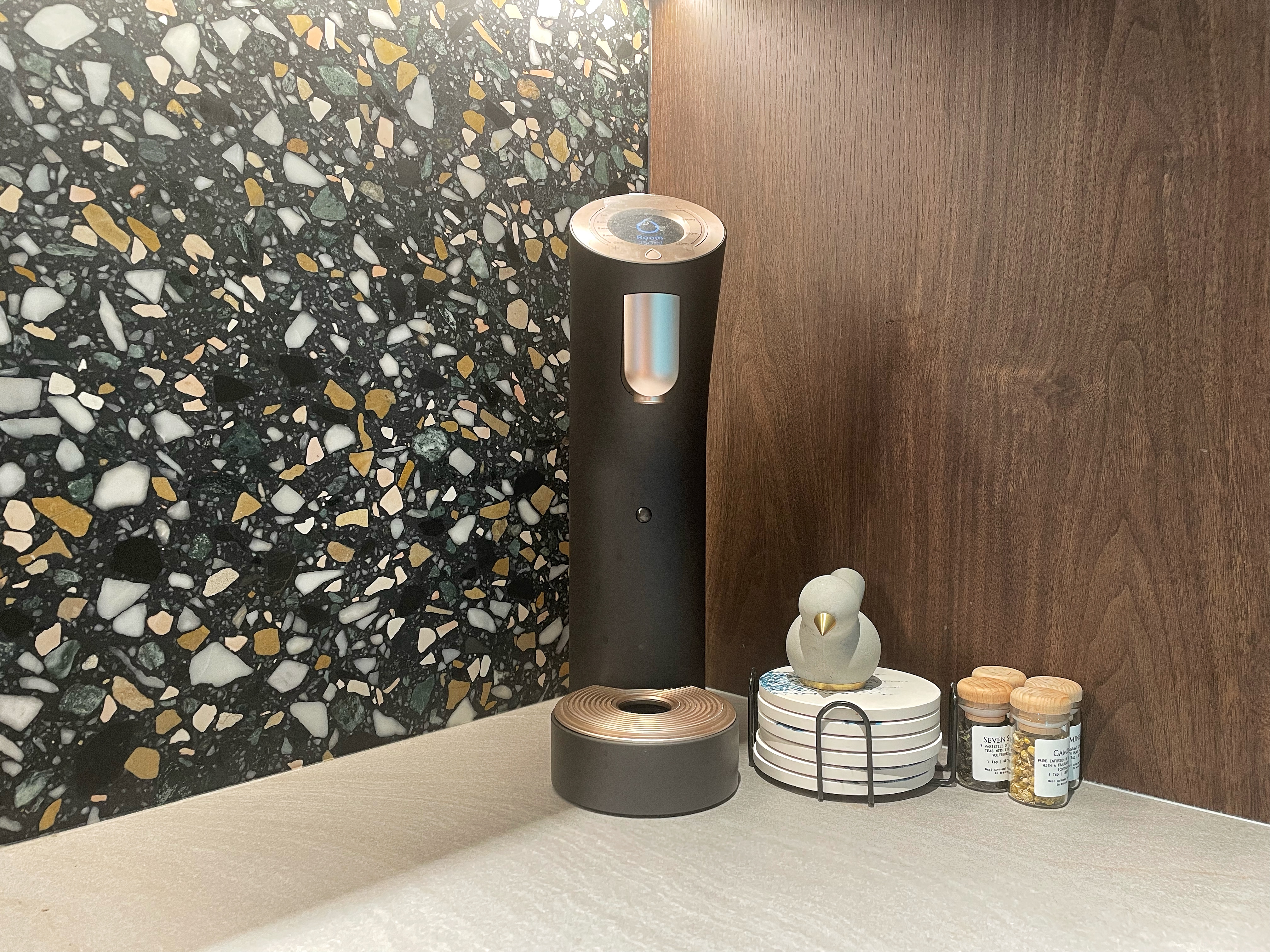 The unconventional  - mosaic-patterned wall, modern kitchen counter, decorative tiles, geometric mosaic design, colorful