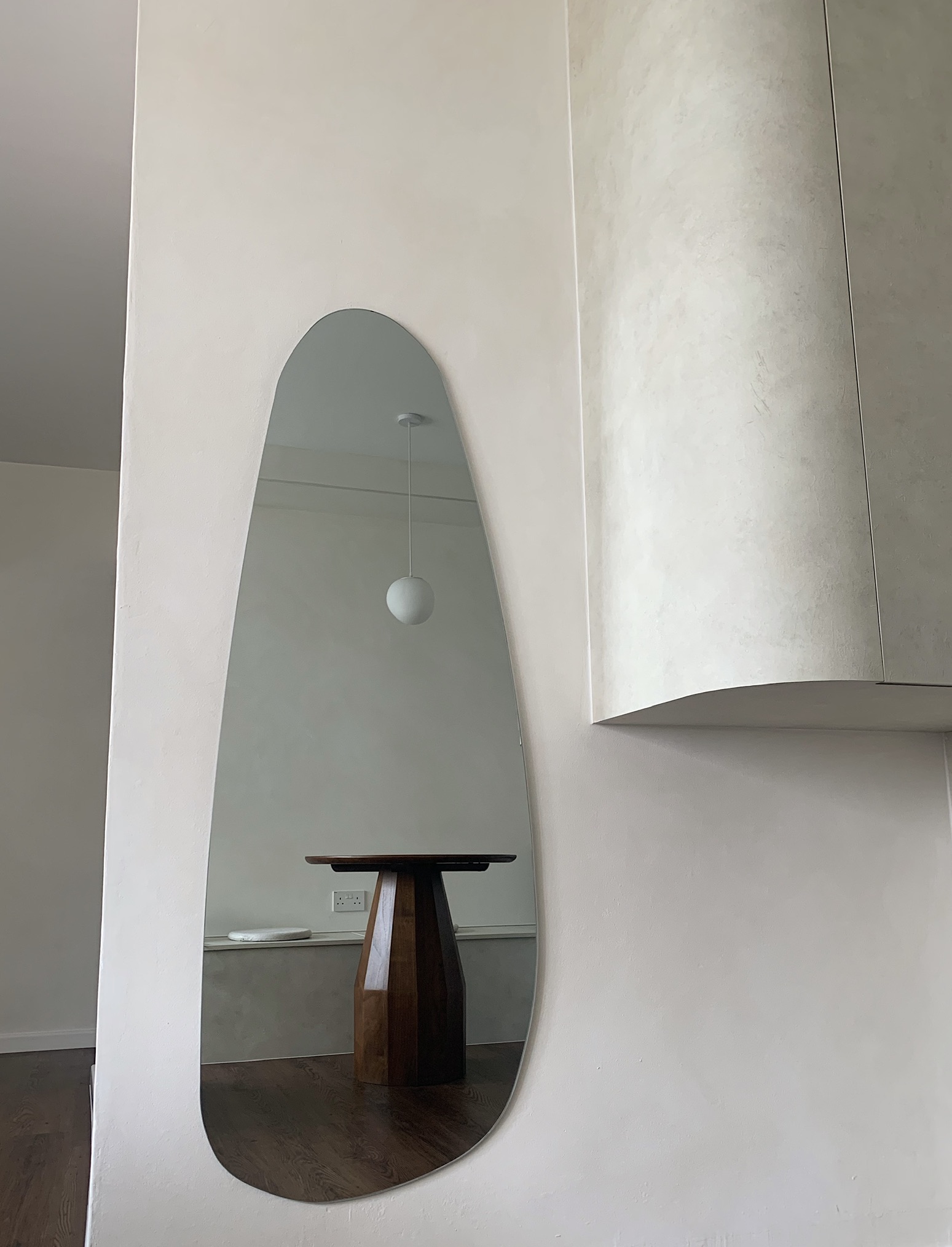 Inside a Warm & Welcoming Resale Flat | Central Region - Modern minimalist interior, white wall with arch mirror, wooden