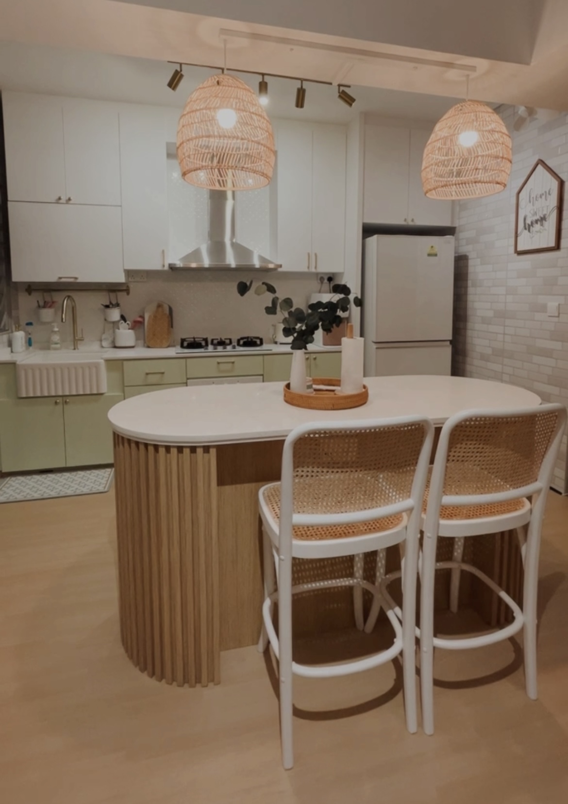 Welcome to our cosy and humble 5-room BTO :)  - Modern kitchen with white cabinets, light countertops, and wooden accents.