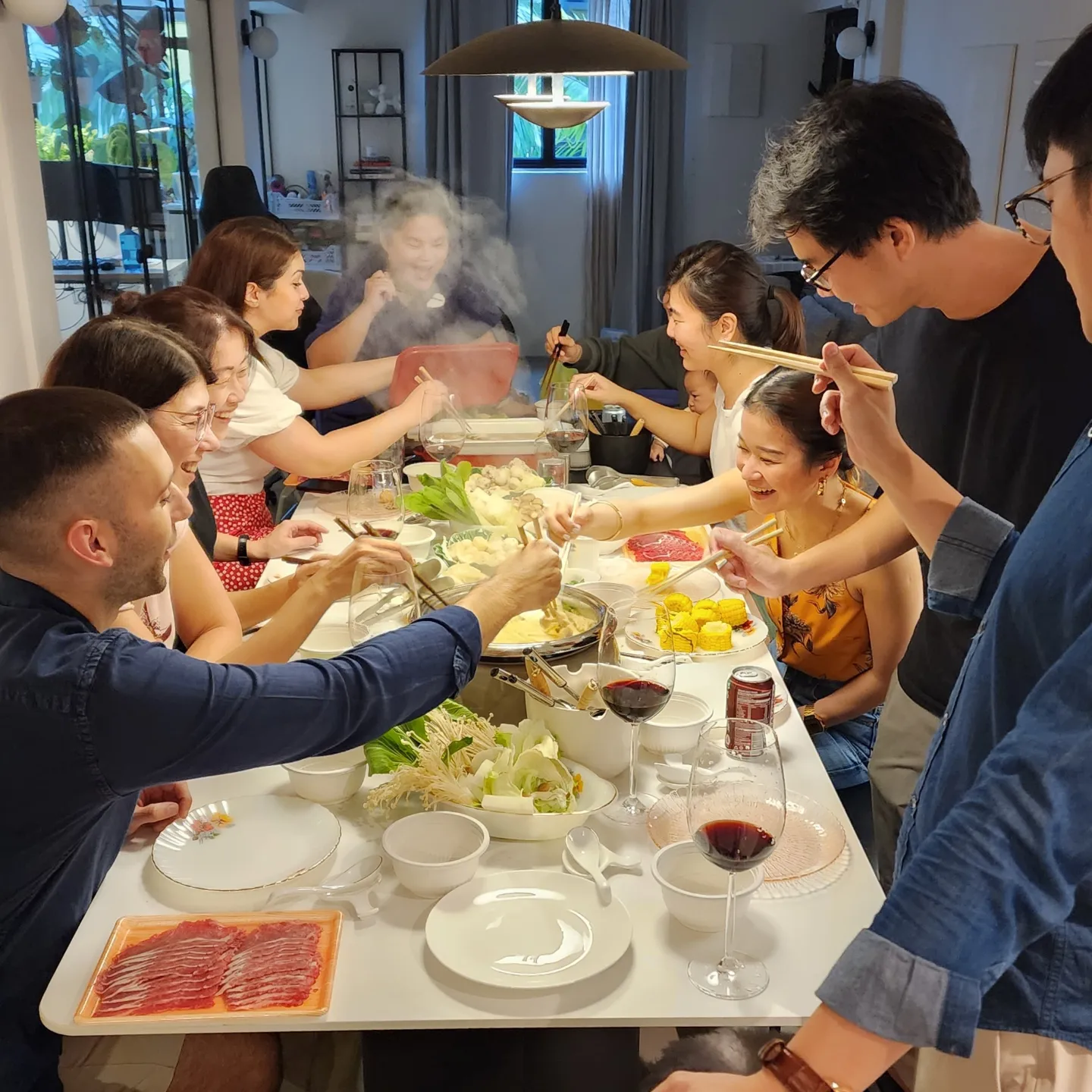 Monochromatic Everton Park home meant for hosting! - Group of people enjoying a meal, Asian cuisine, hot pot, wine, various