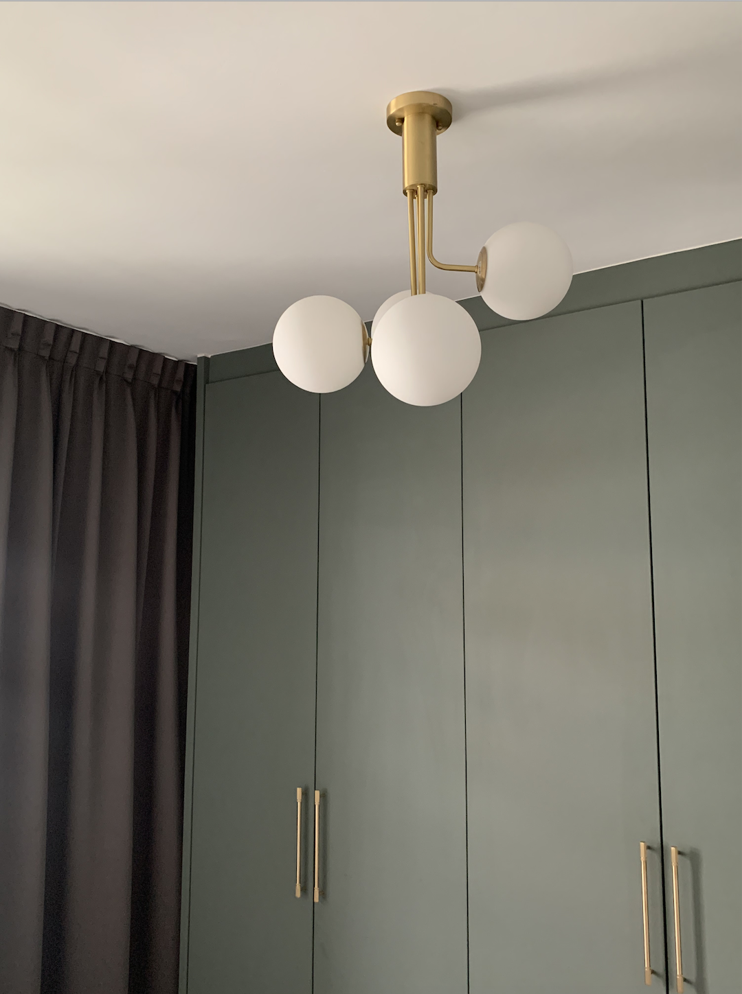 Mid-century modern master bedroom with walk in wardrobe in 4 room BTO - Modern pendant light fixture with gold accents