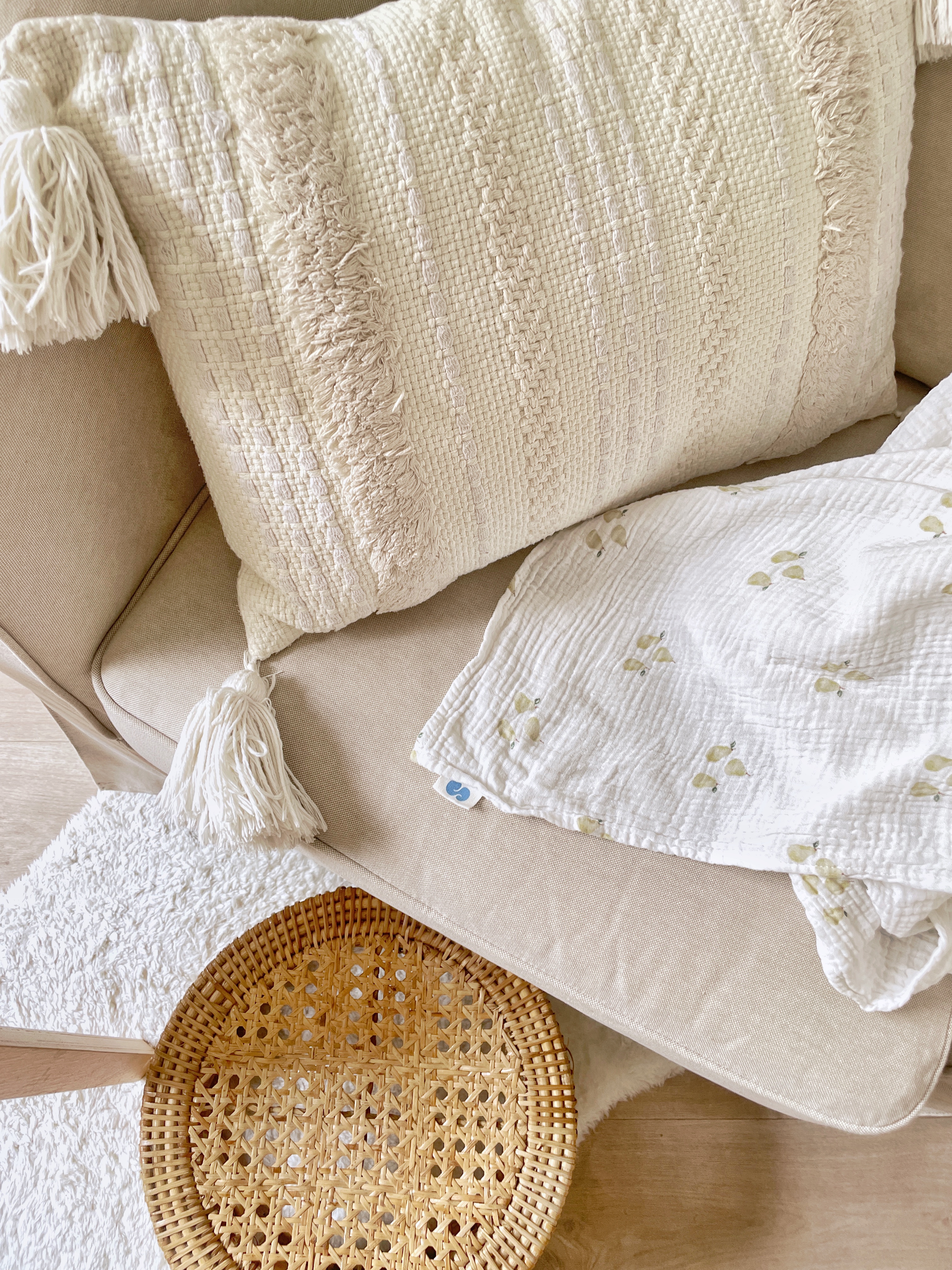 Little cosy corner | great for me-time - Cream-colored knitted throw blanket, beige sofa, textured fabric, fringed tassels