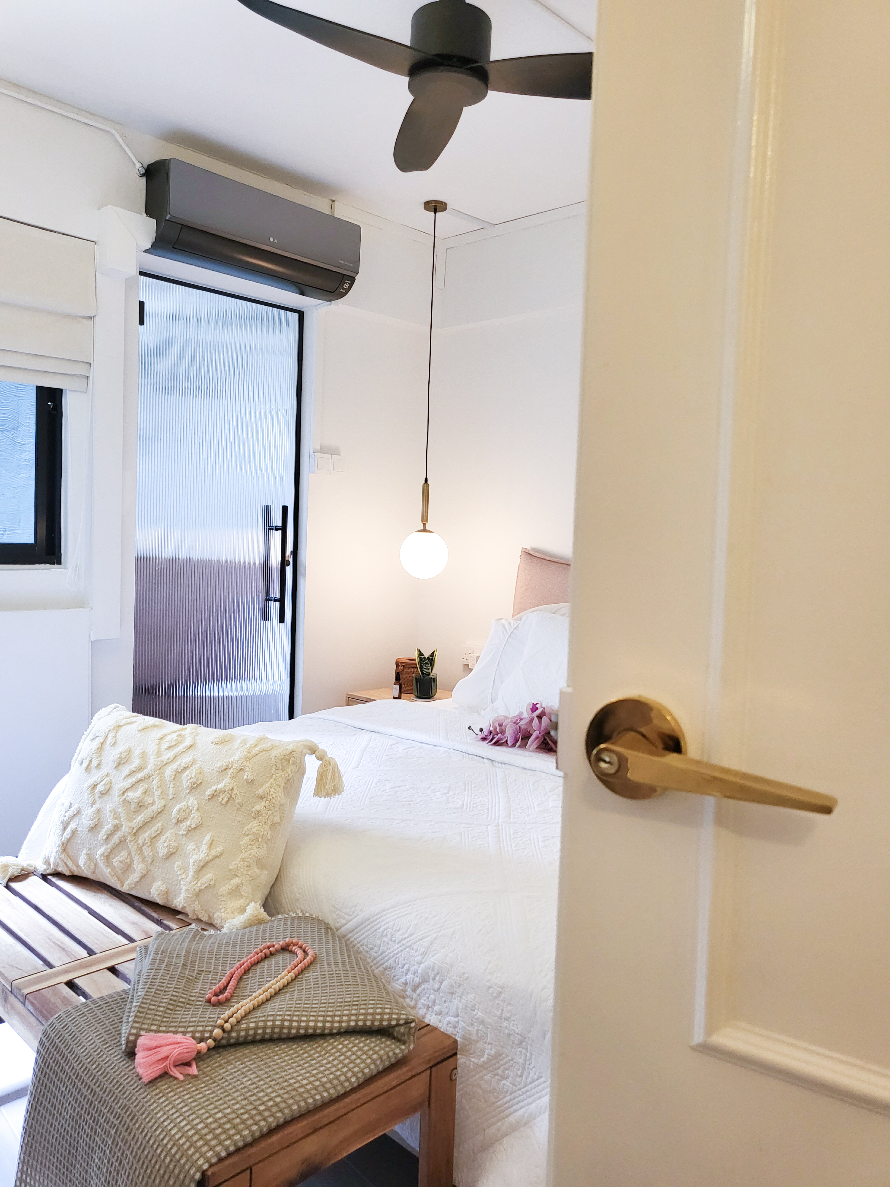 Falling in love with a romantic villa bedroom  - White bedroom with wooden furniture, beige and green pillows, pink tassel