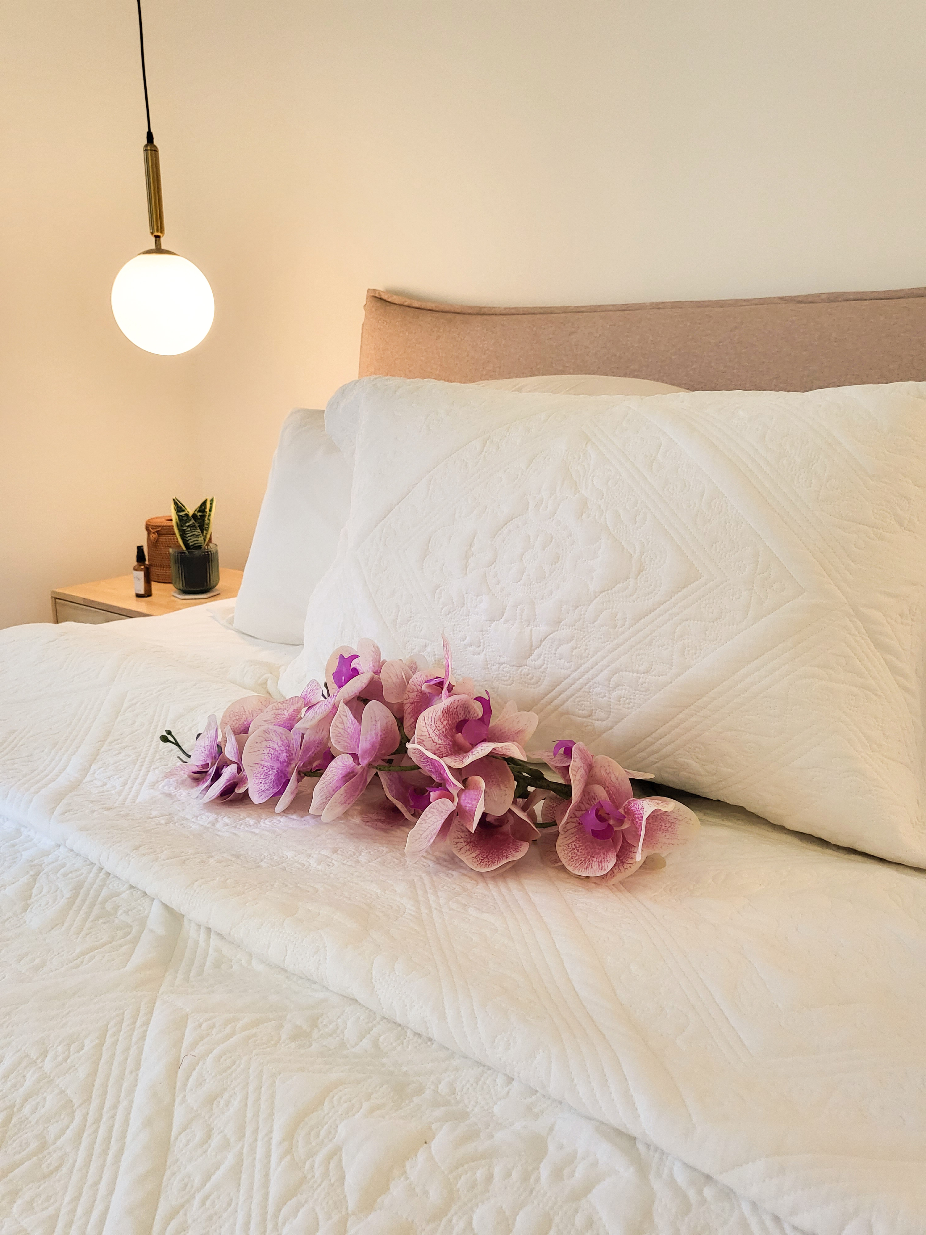 Falling in love with a romantic villa bedroom  - White quilted bedspread, soft lighting, elegant pendant light, modern