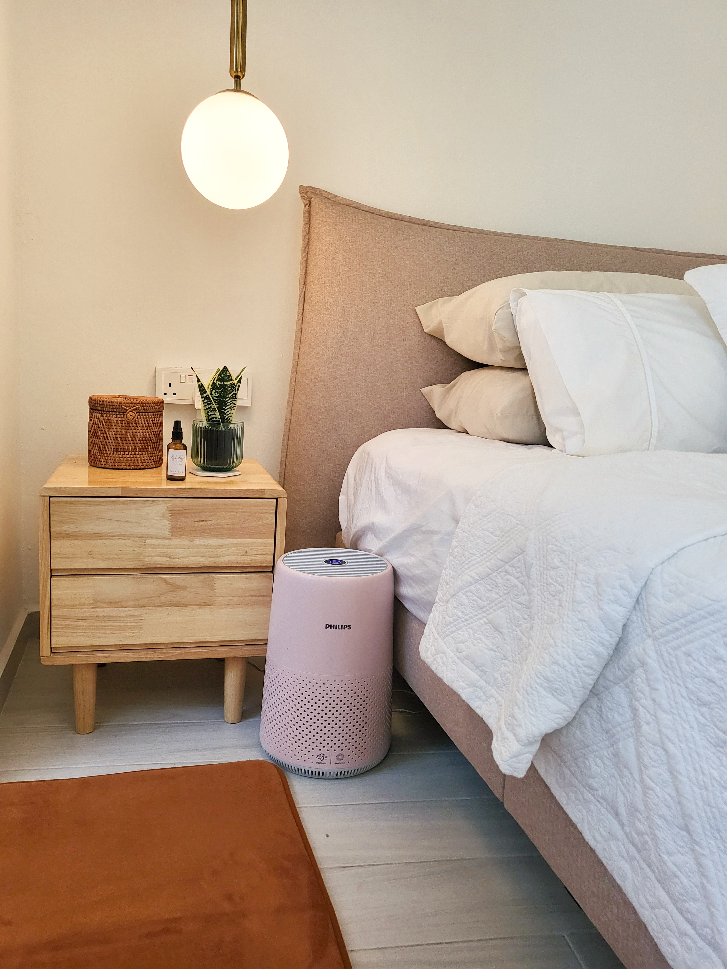 Falling in love with a romantic villa bedroom  - Wooden nightstand with woven basket, small potted plant, brown textured