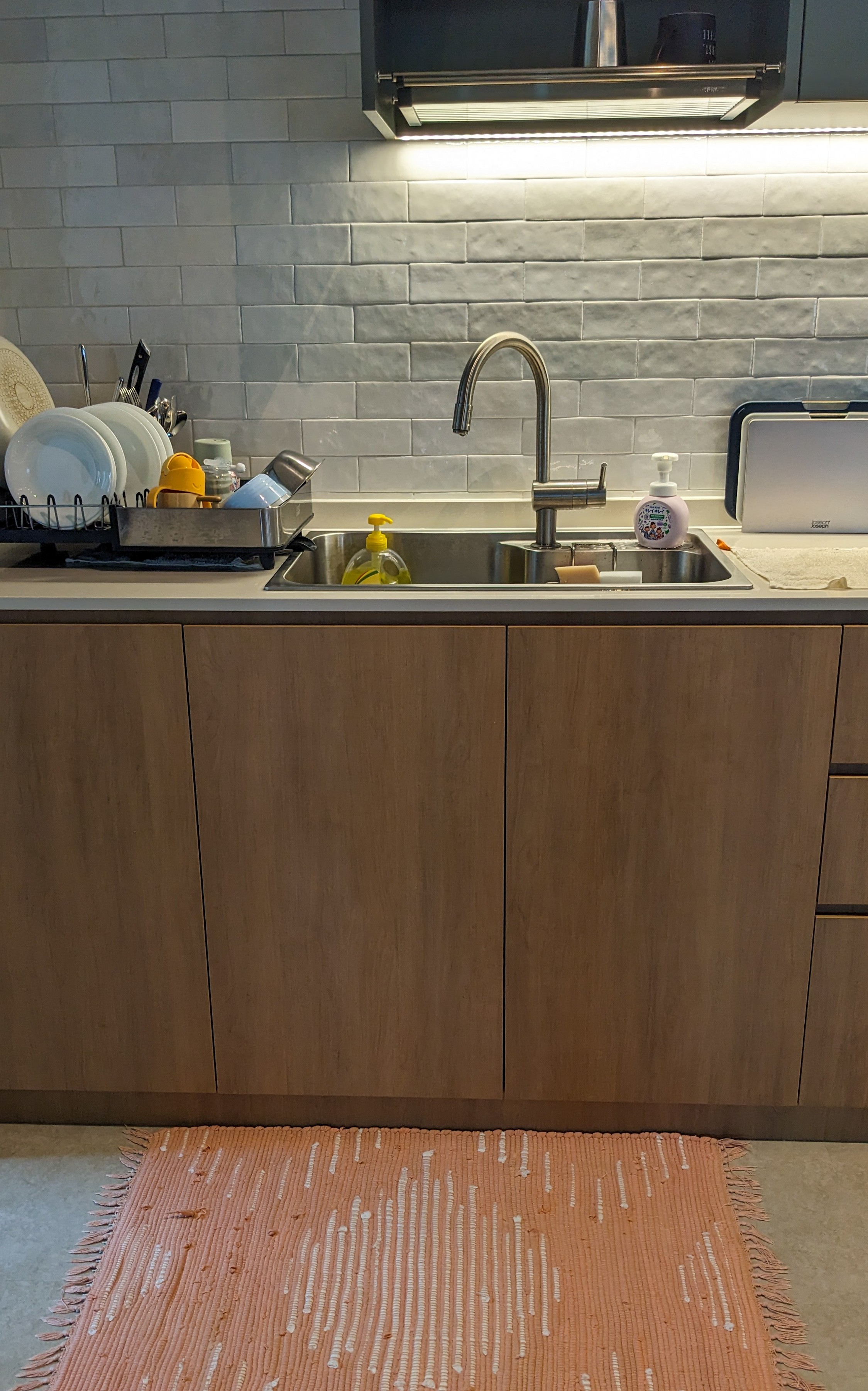 Our Kitchen | The pièce de résistance - modern kitchen, stainless steel sink, wooden cabinets, dish rack, white tiles