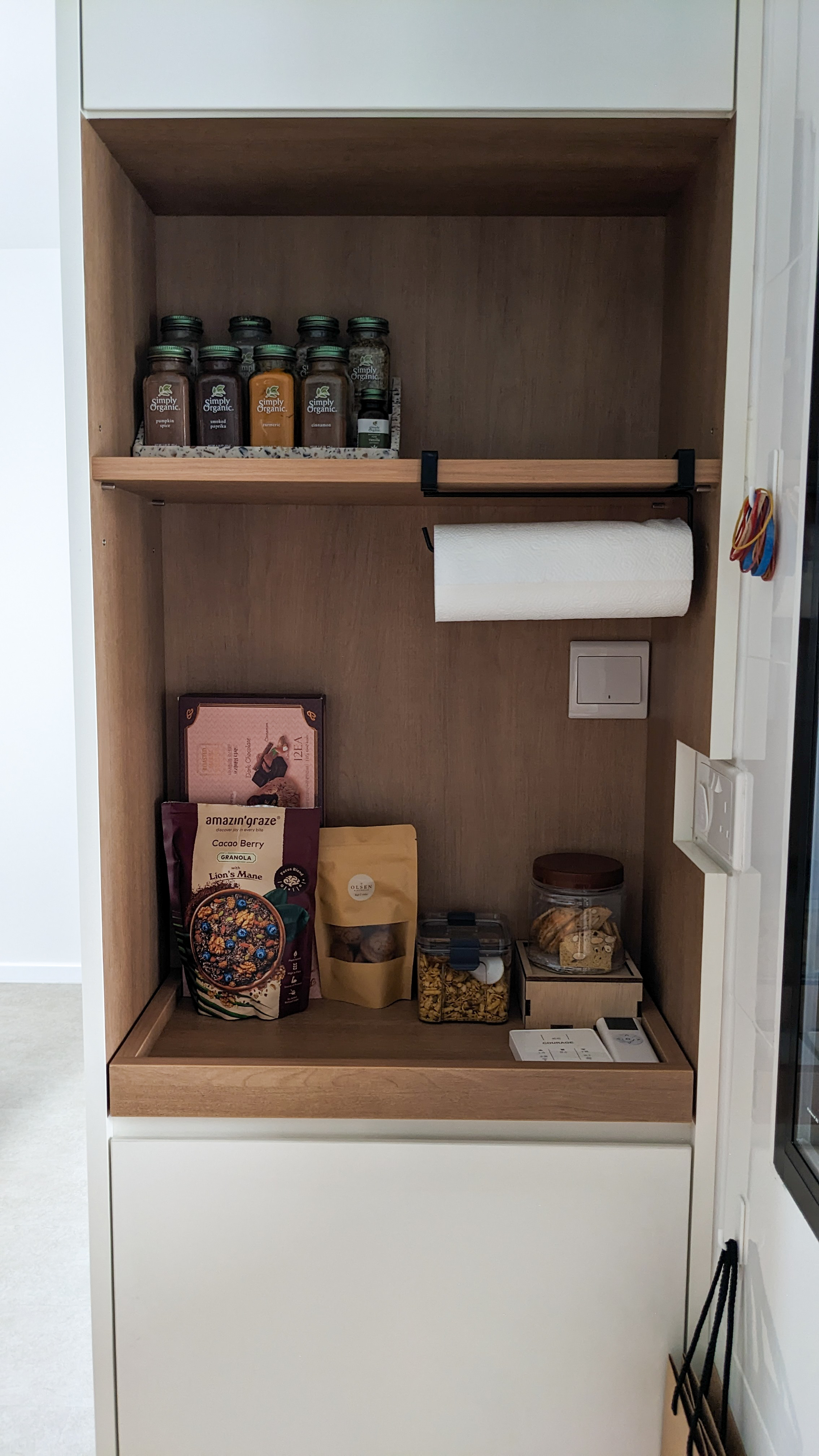 Our Kitchen | The pièce de résistance - Organic jars, wooden shelf, neatly arranged spices, Simply Organic bottles, paper