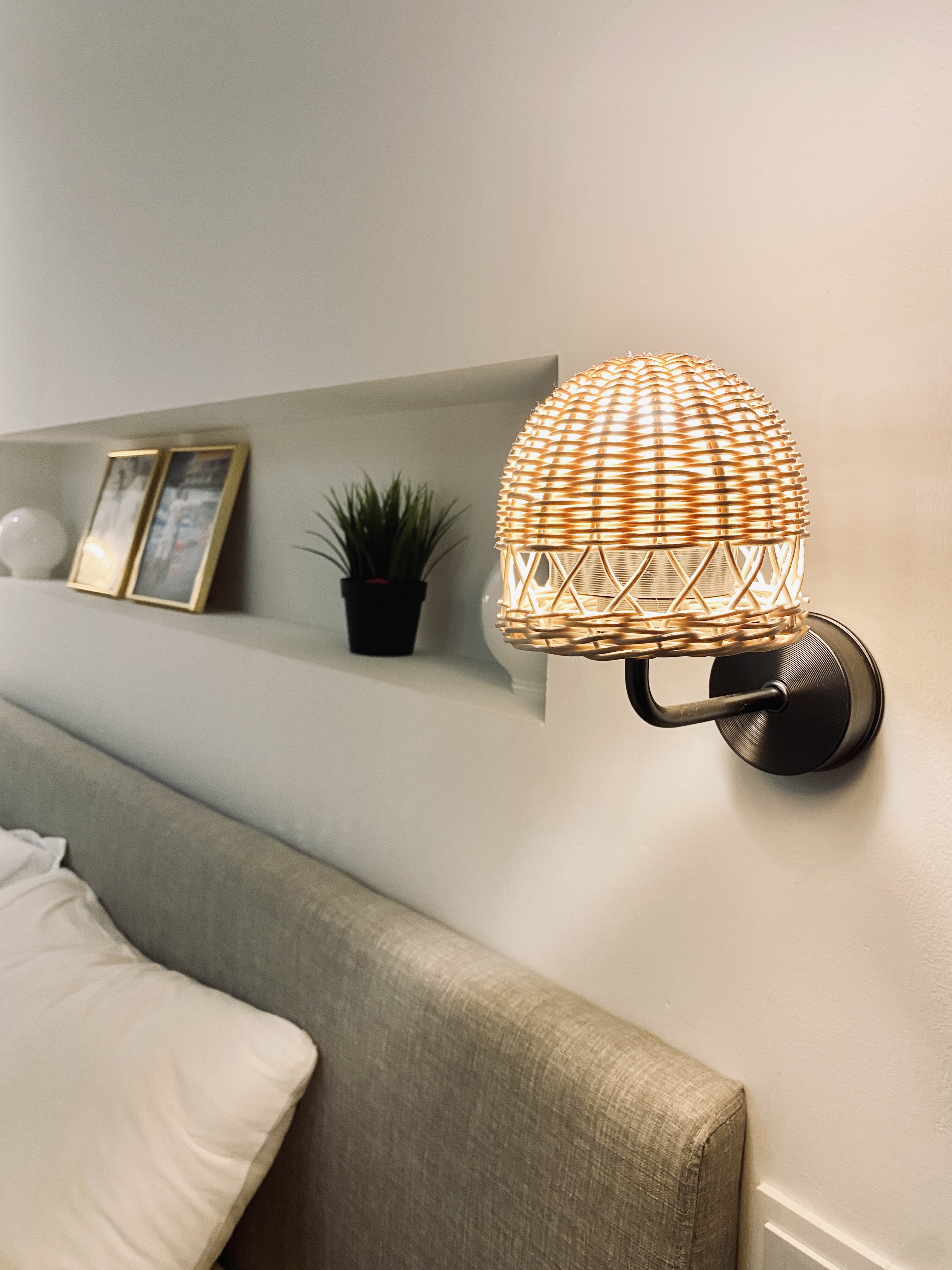 Minimalistic bedroom with a hidden closet and bathroom - Woven lamp with warm light, modern interior design, beige sofa