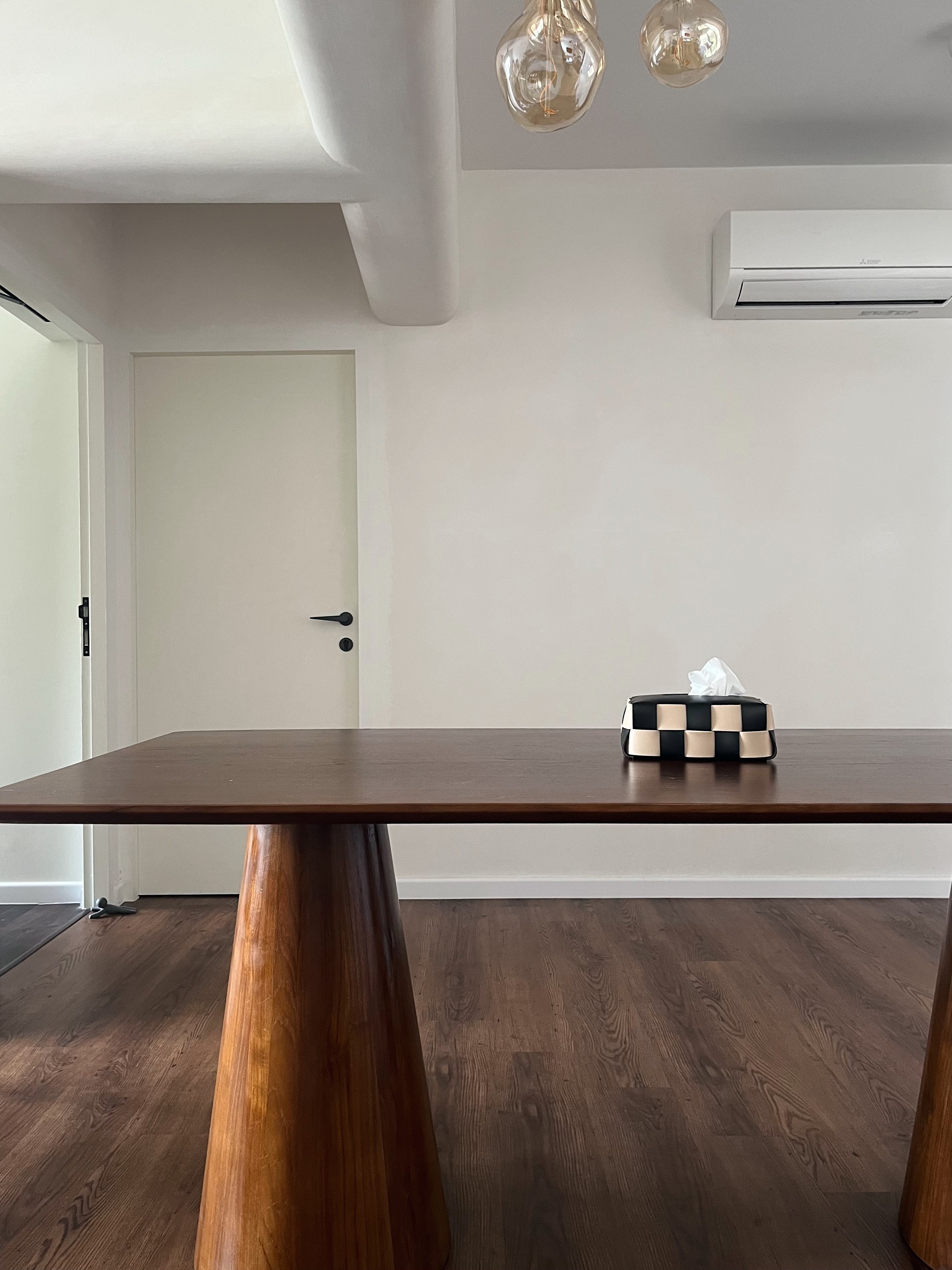 Purposefully Designed Dining Spaces for Dining & Admiring  - modern minimalist dining room, sleek wooden table, polished dark