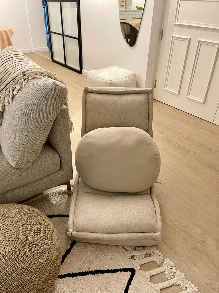 A tour in our Living Room - Cream-colored, plush armchair with a soft cushion, beige sofa with a textured throw blanket