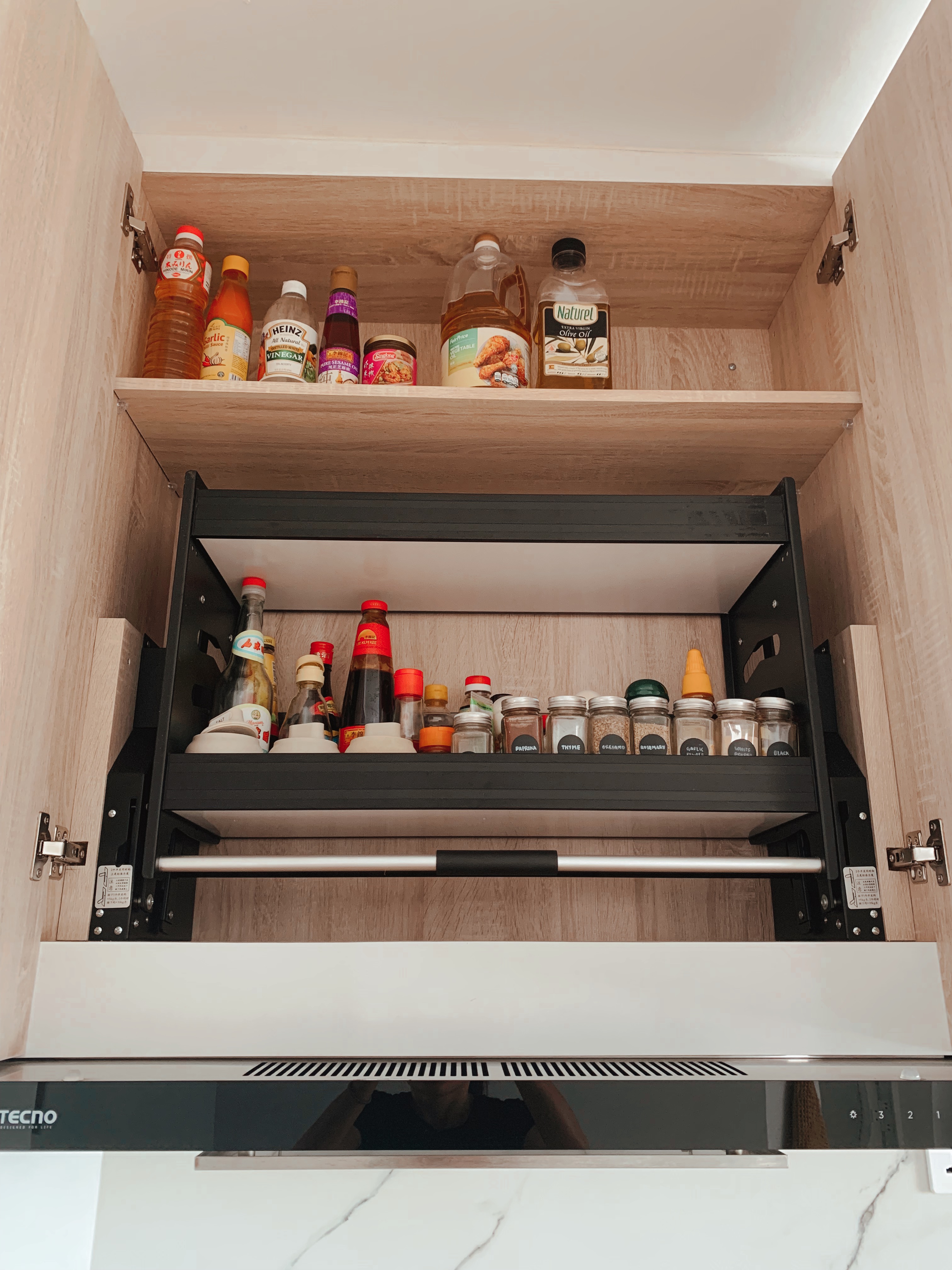 Our open-concept but practical kitchen - Wooden kitchen cabinet, spice rack, organized spice collection, various condiments