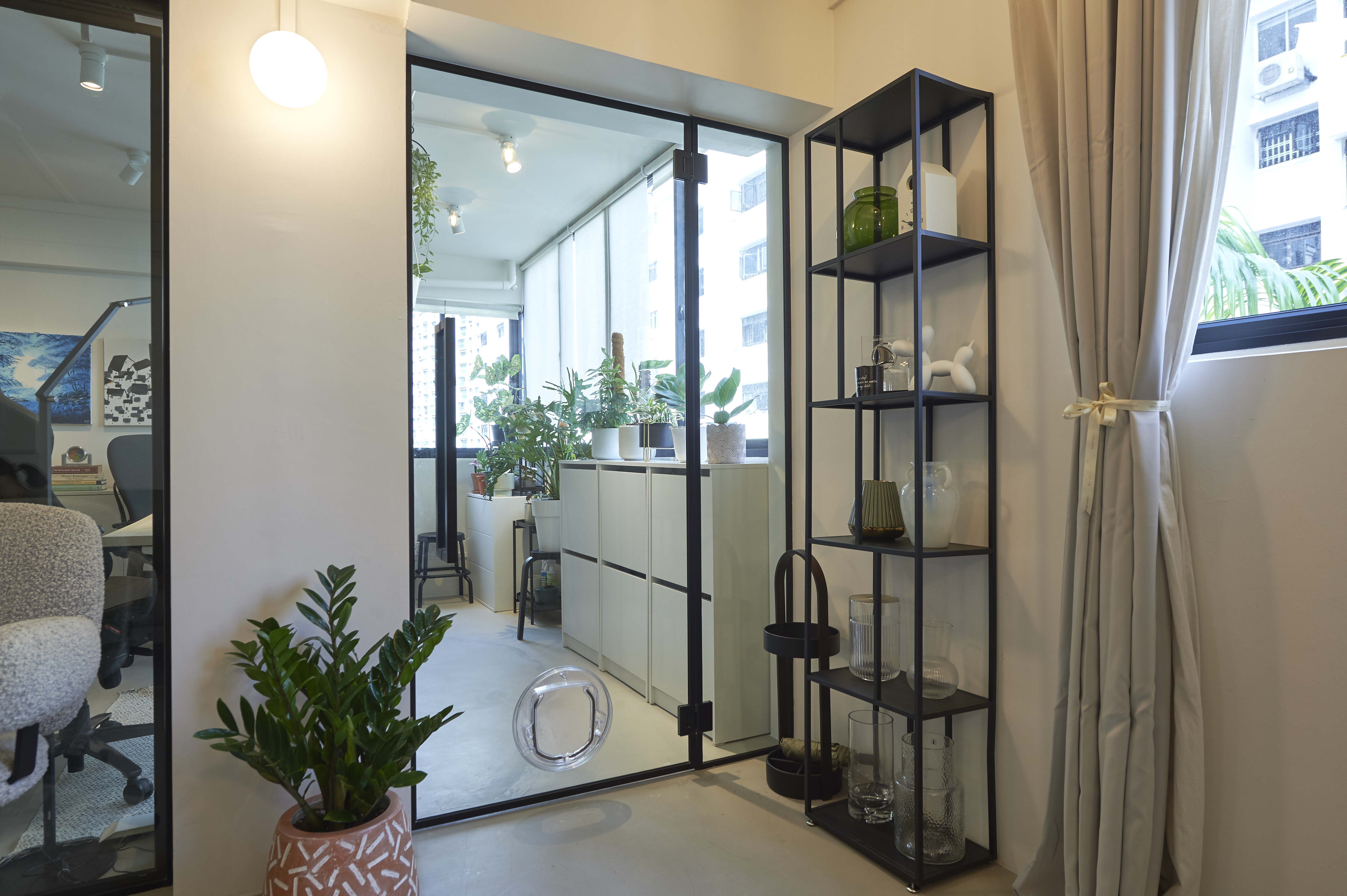 Balcony Garden With Doggy Door & Shoe Storage - Modern office interior, glass door entrance, indoor plant, beige curtains