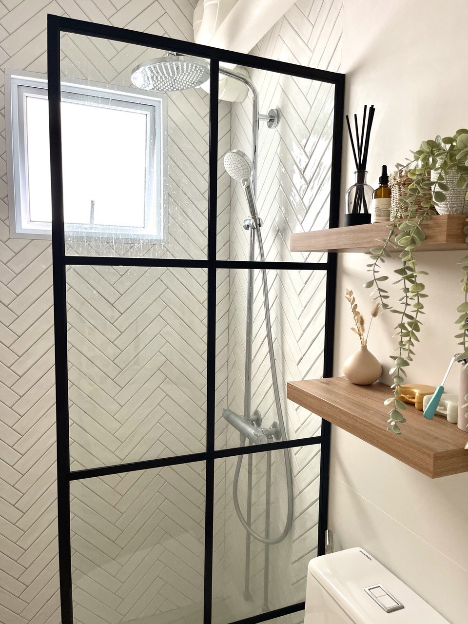 Our Private Sanctuary - Herringbone-patterned shower enclosure, modern shower head, black frame, frosted glass, white