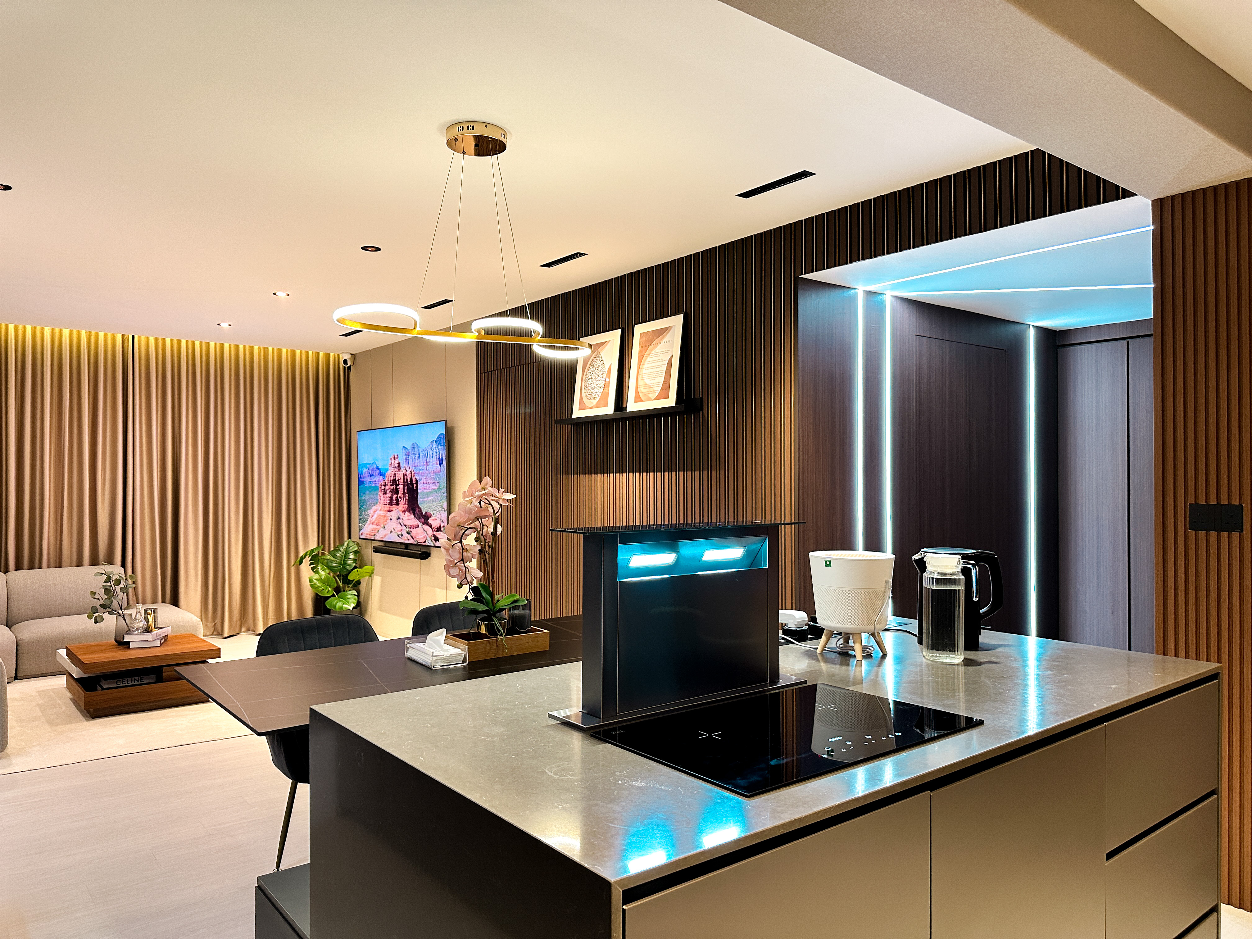 Hotel-like Luxe in a Home - Modern living room with sleek design, contemporary furniture, large flat-screen TV, beige