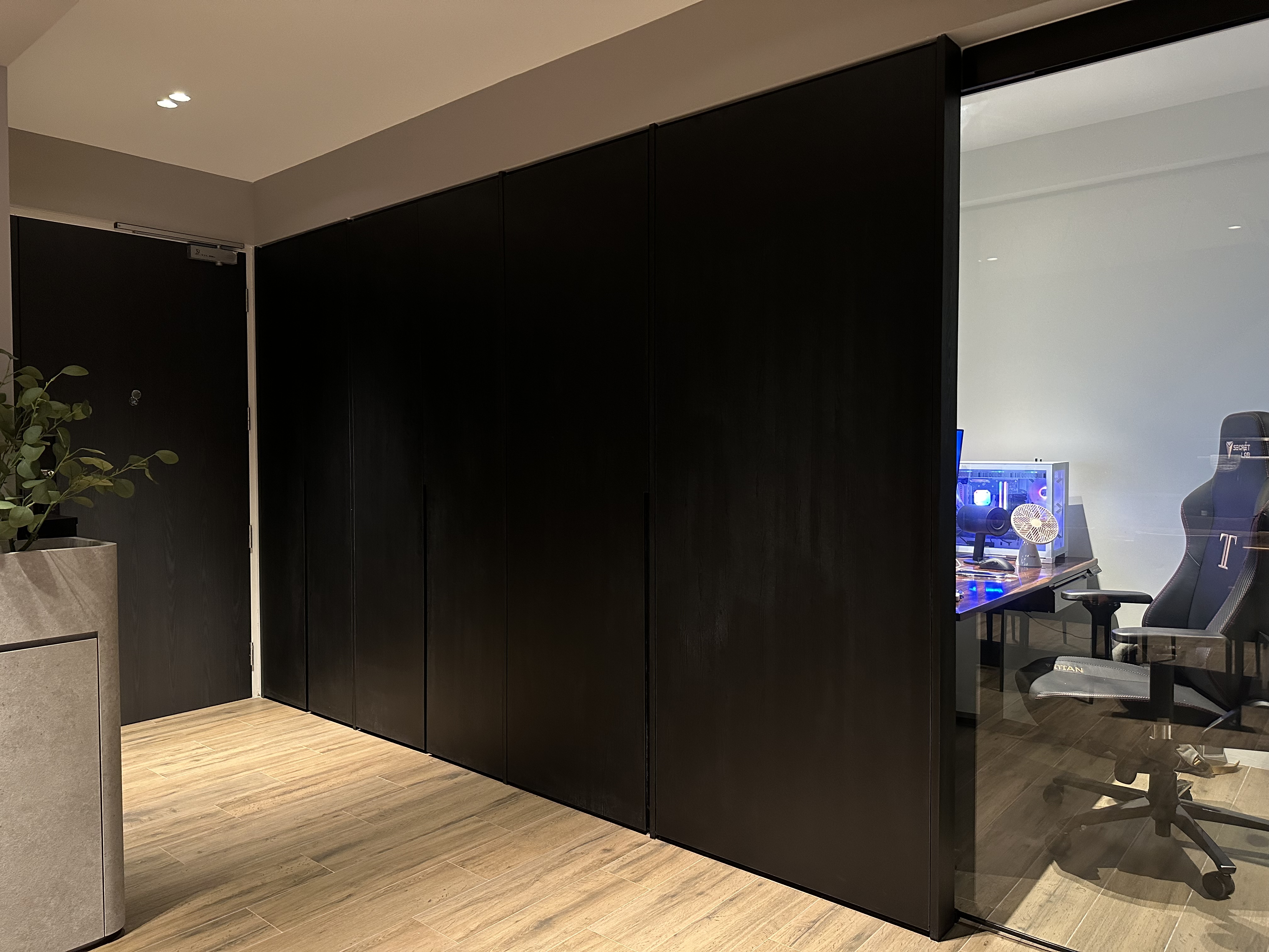 Entryway 🚪 - Dark wooden wardrobe, sleek black cabinets, modern interior design, minimalist space, open door, glass