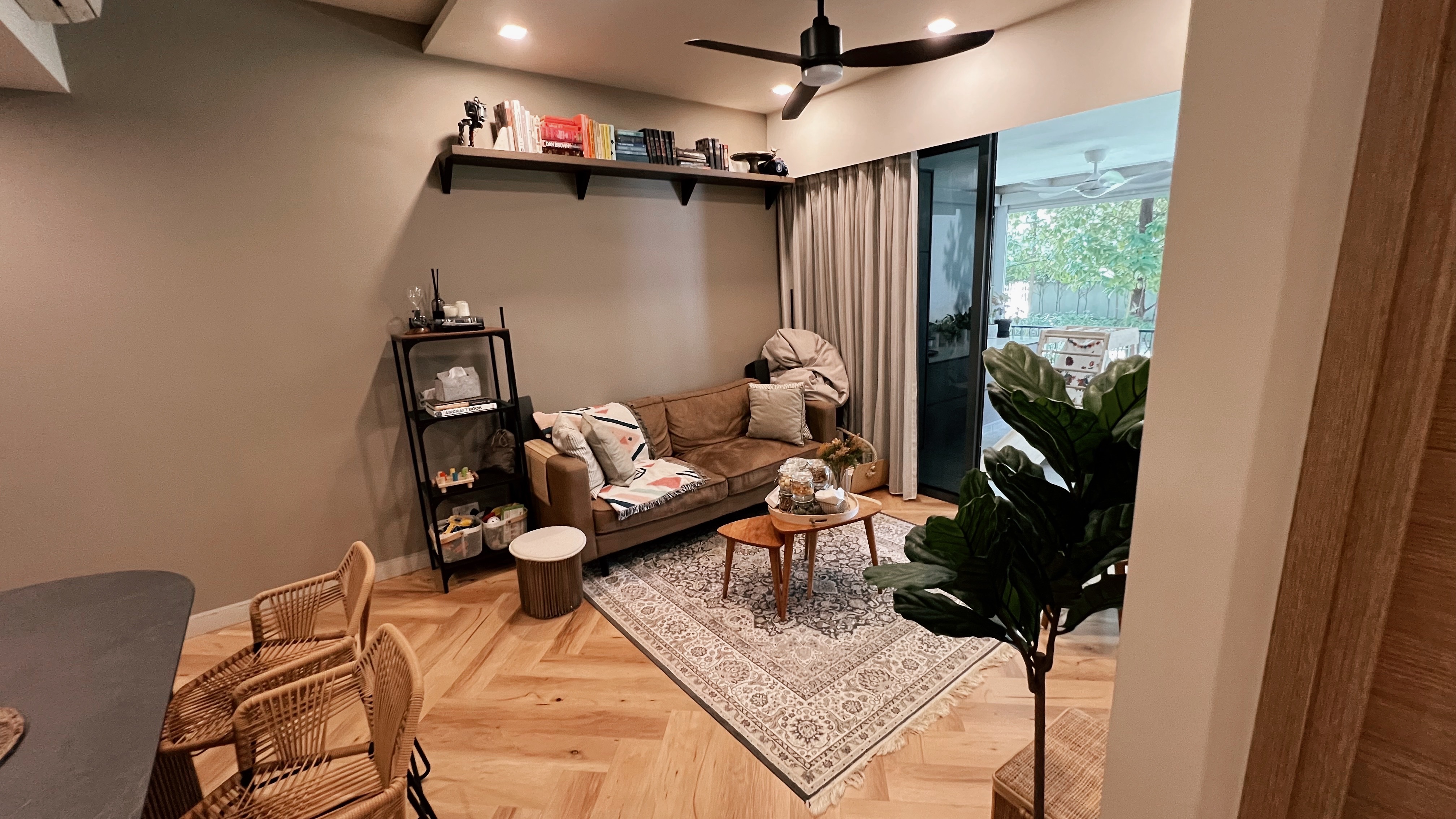 1260sqft ground floor unit with a garden view! - modern living room, cozy seating, brown sofa, patterned rug, wooden floor