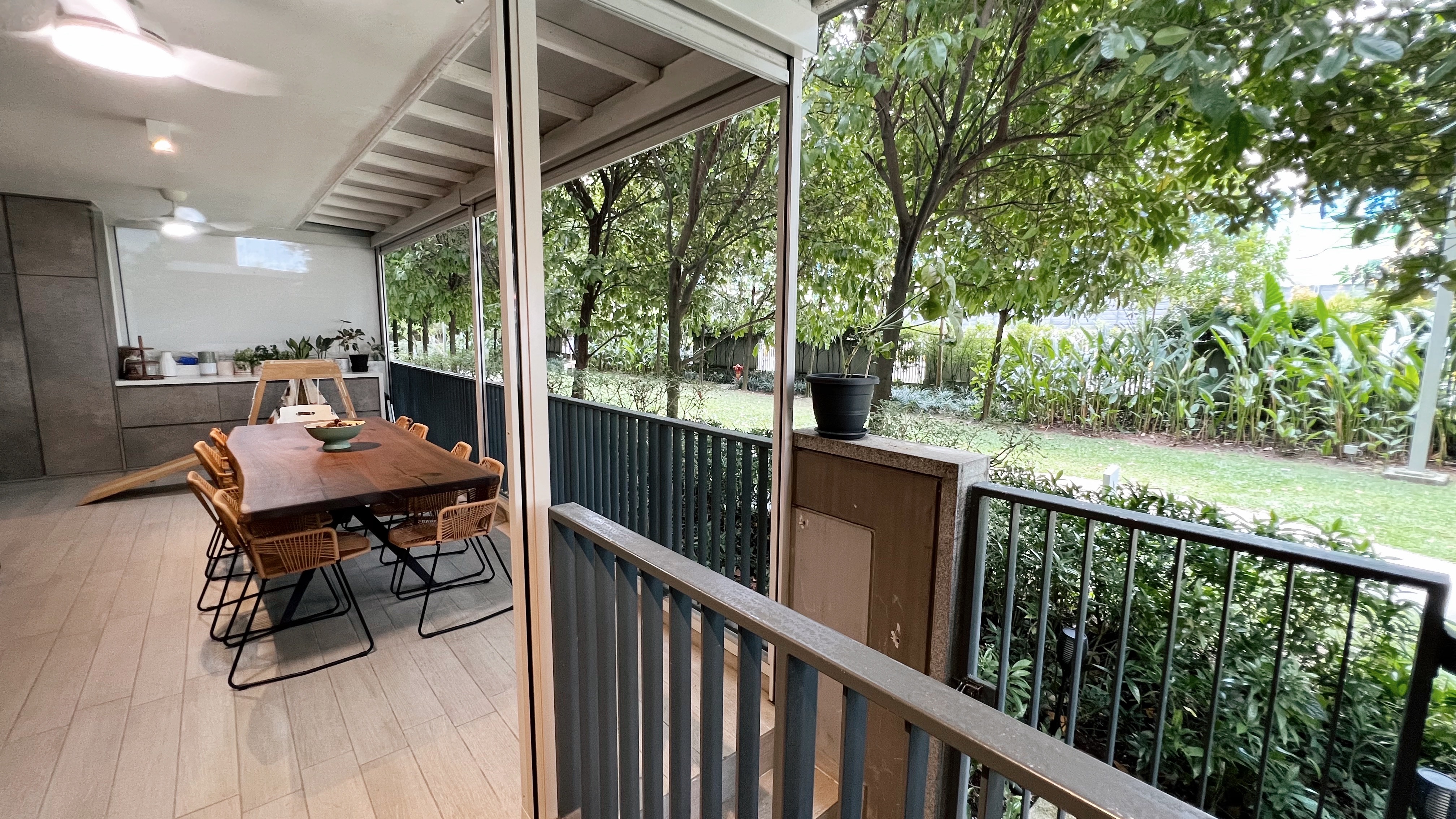 1260sqft ground floor unit with a garden view! - modern dining room, outdoor patio, wooden dining table, wicker chairs