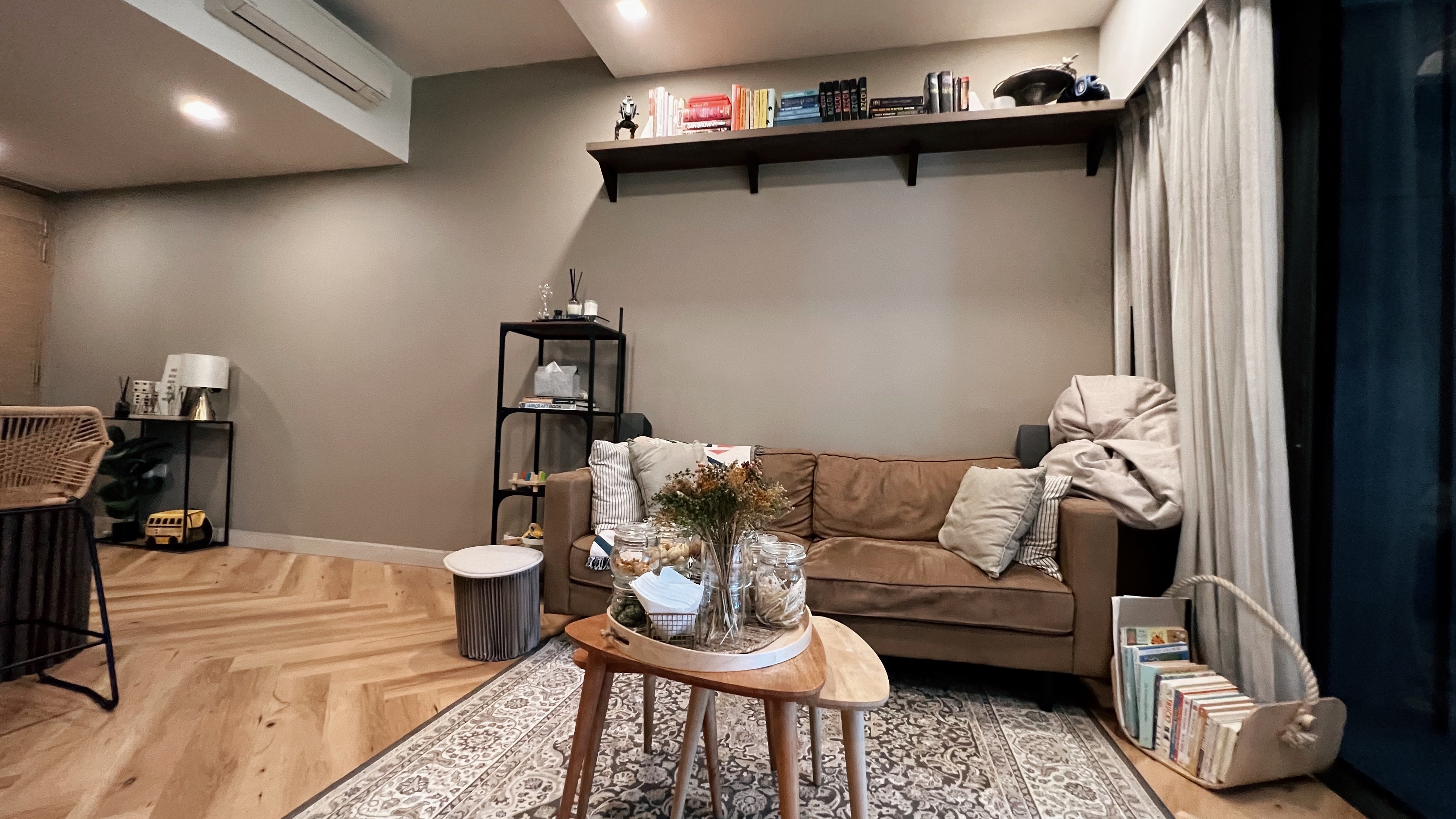 A living room refresh for Hari Raya! - Modern living room, cozy seating area, warm lighting, wooden floor, herringbone