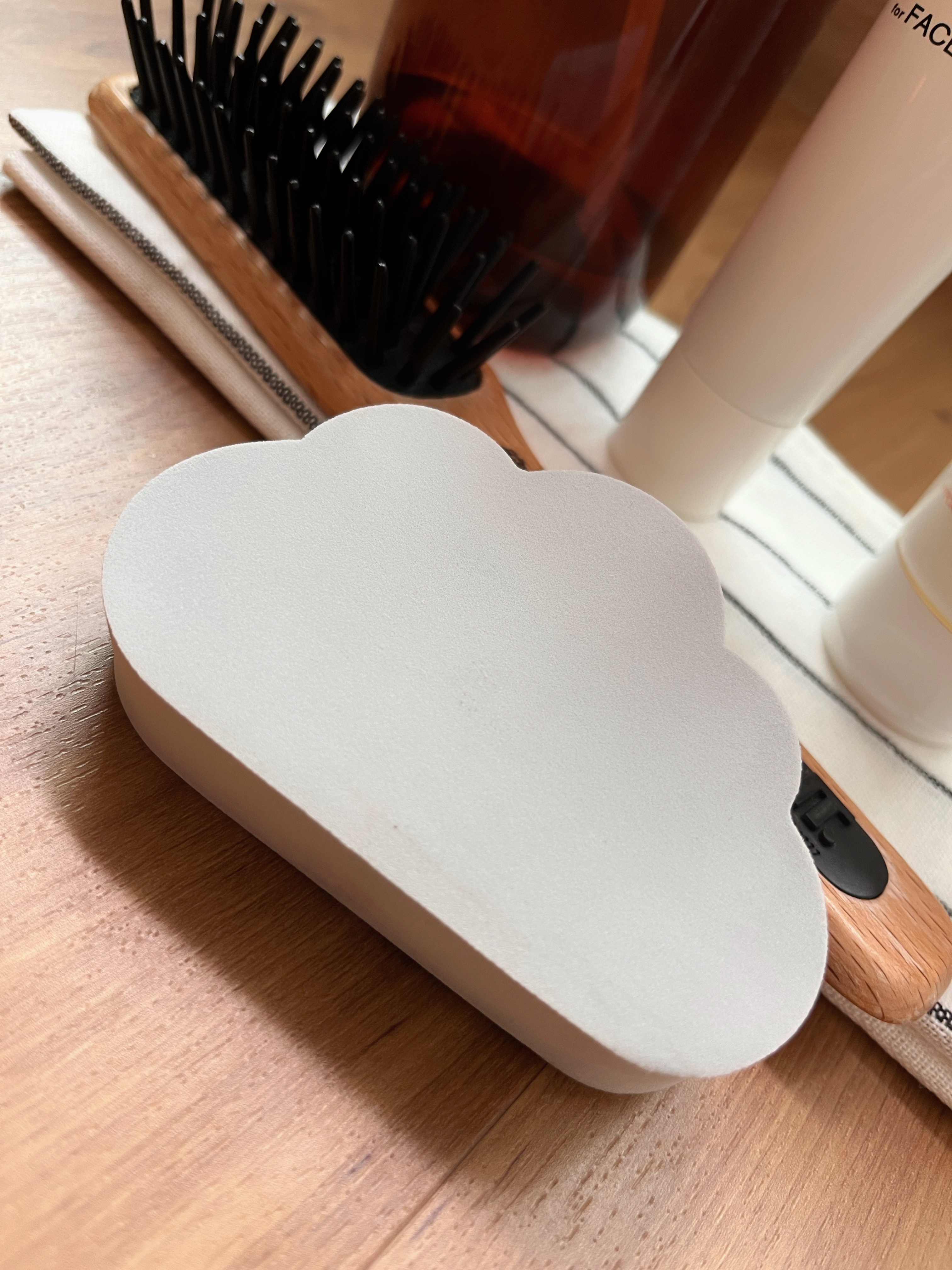 Favourite home purchases 6 months in! (Part 1) - Wooden surface, white cloud-shaped container, black hairbrush, wooden comb